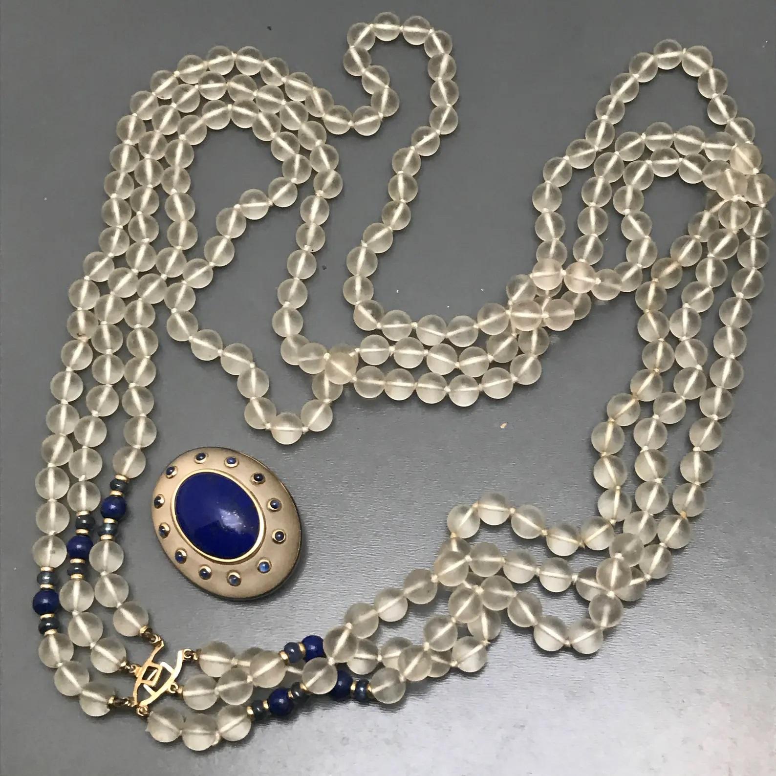  Highly Collectible Vintage  Signed  Trianon Frosted Crystal ,  Gold Multi Strand Necklace  with removable pin /brooch . The central pendant can be easily removed an worn as a pin , featuring a large frosted rock crystal , with tiny genuine