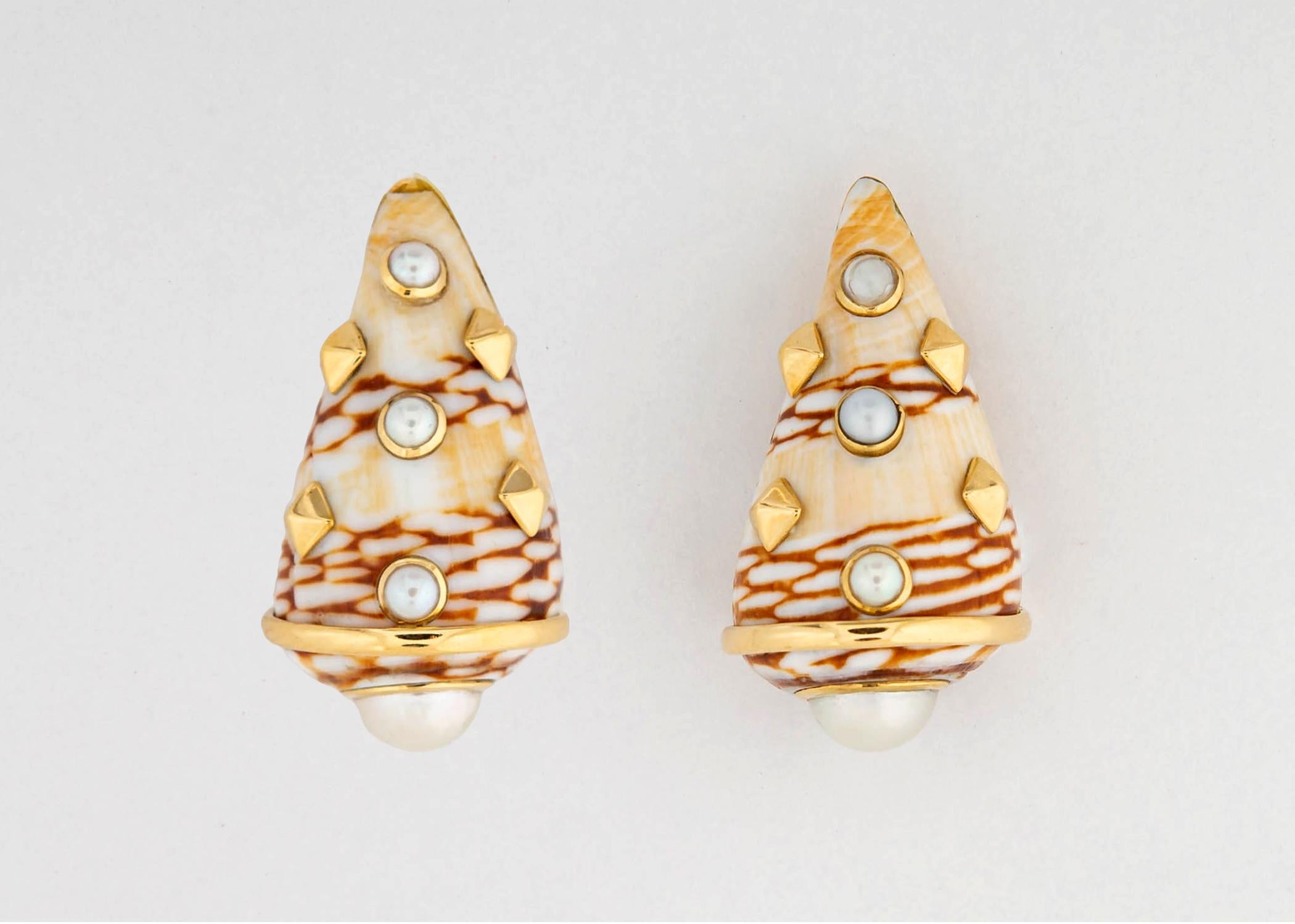 Trianon is famous for there natural shell earrings. This pair features carmel and beige colors accented with beautiful white pearls and 18k gold detailing. Almost 1 1/4 inches in length.