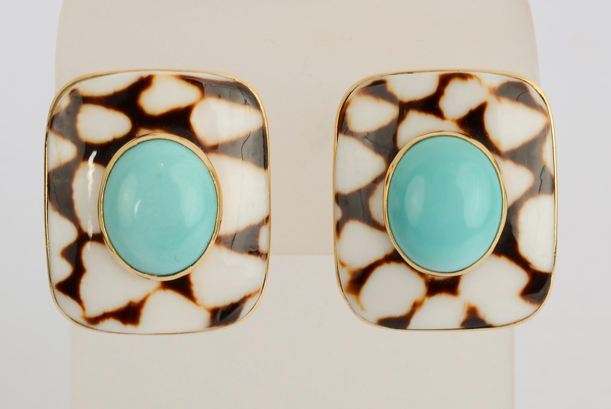 Wonderfully summery rectangular shell earrings set with turquoise made by Trianon. The dramatic dark brown and white pattern of the shell highlights the turquoise color. Clip backs can be converted to posts. Lighter color in the upper right corner