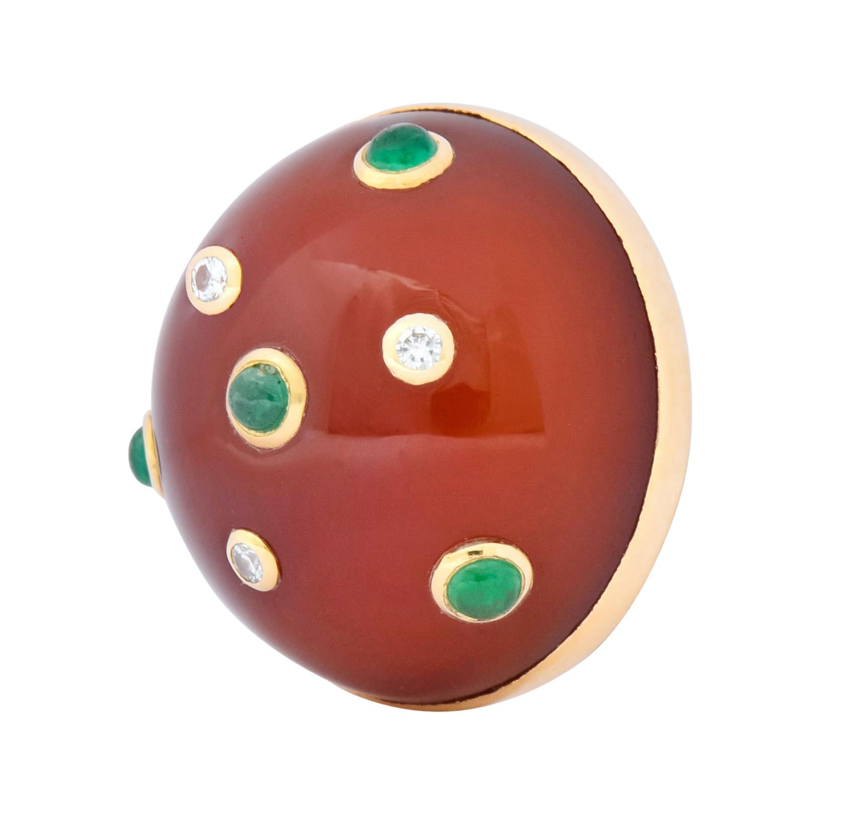 Earrings designed as round domes comprised of brick red carnelian bezel set in a polished gold surround

Accented by round emerald cabochons measuring approximately 2.2 mm, translucent and bright green in color

With bezel set Swiss cut diamonds