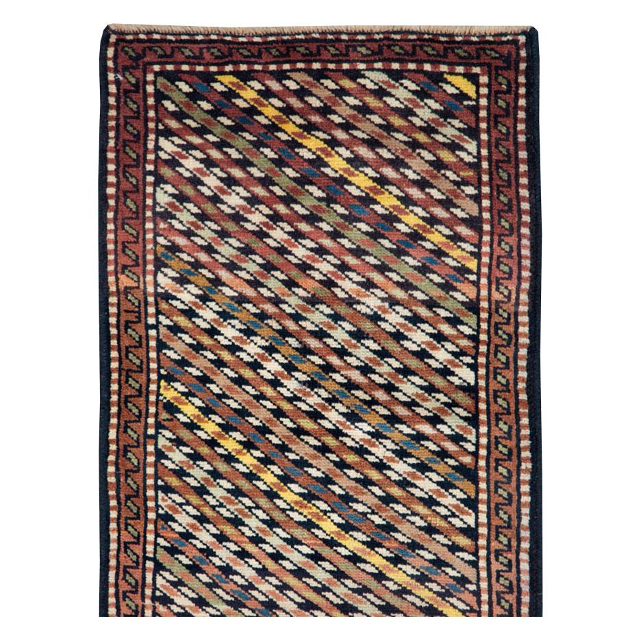 A tribal Persian Kurd small runner handmade during the 21st century.

Measures: 1' 10