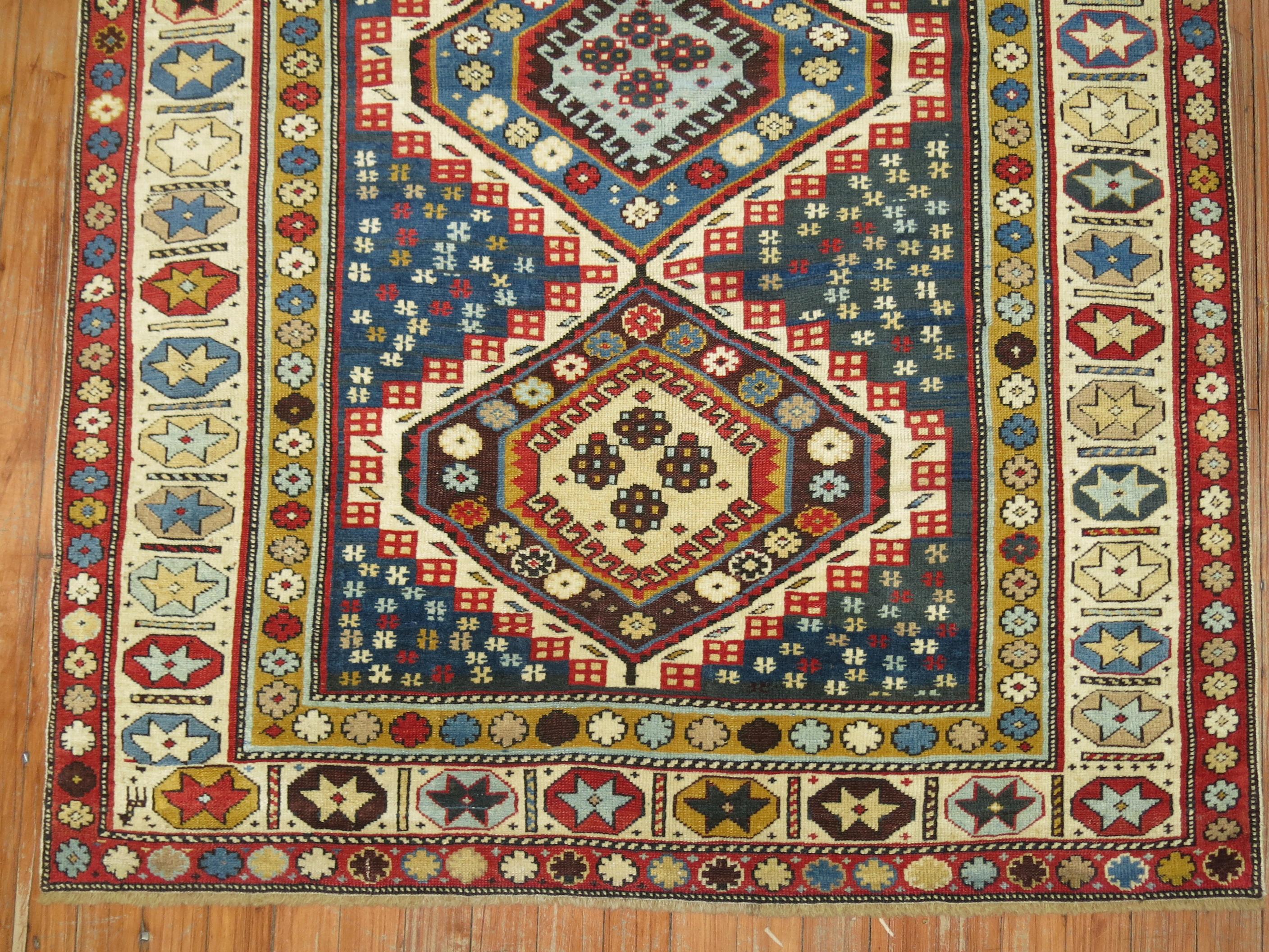 Decorative colored early 20th century handmade Kuba rug in easy-going earthy tribal palette.