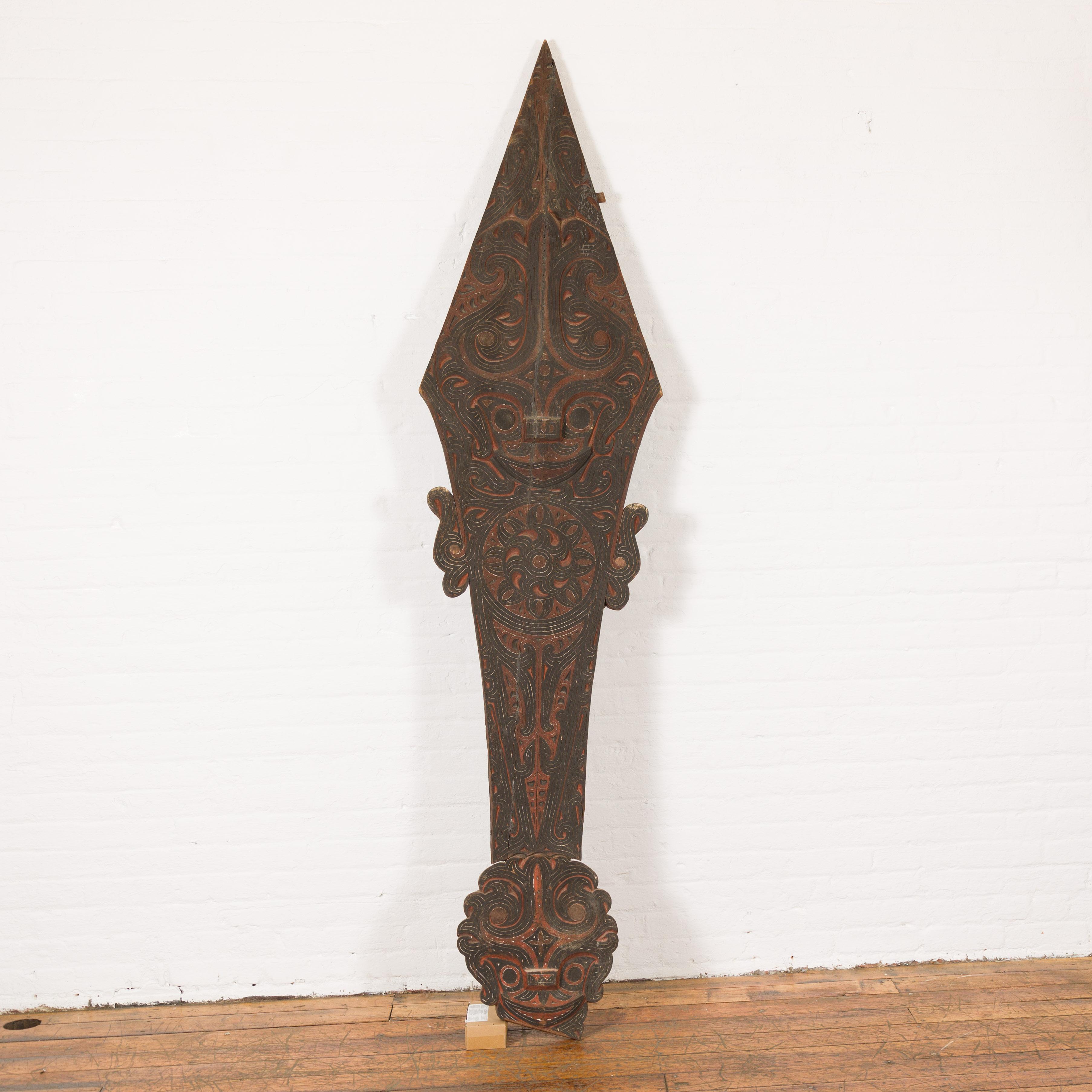 An antique hand carved tribal 19th century sculpture from the Batak People, northern Sumatra, called a Singa Singa. Step into the rich tapestry of Indonesian heritage with this captivating 19th-century Singa Singa sculpture, meticulously hand-carved
