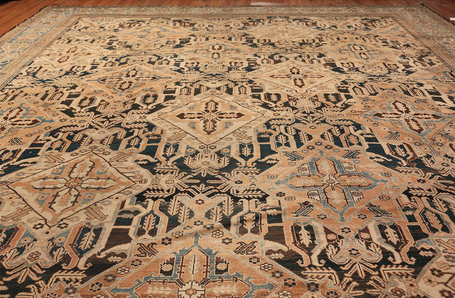 Beautiful Tribal Antique Oversized Persian Bakhtirari Rug, Country of Origin / Rug Type: Persian Rug, Circa Date: Late 19th Century. Size: 15 ft x 30 ft (4.57 m x 9.14 m)

A starkly intriguing large oversized tribal design covers the body of this