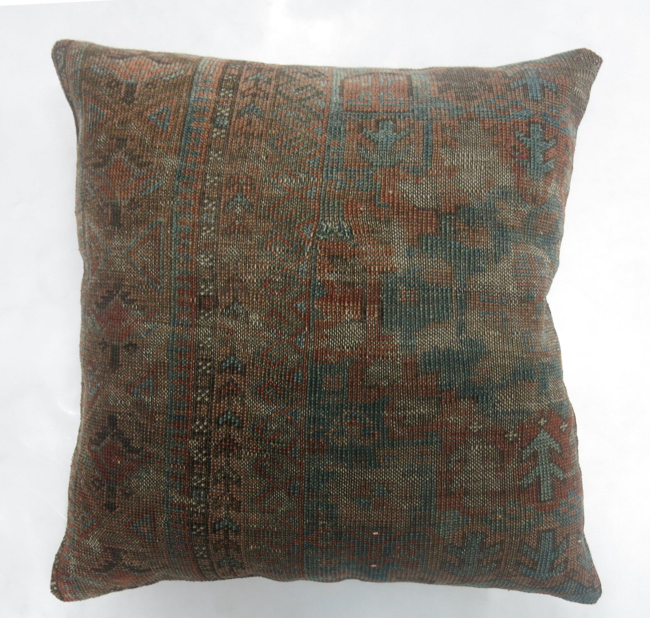 Pillow made from a 19th-century antique Ersari rug in blue and brown with cotton back.

Measures: 20'' x 20''.