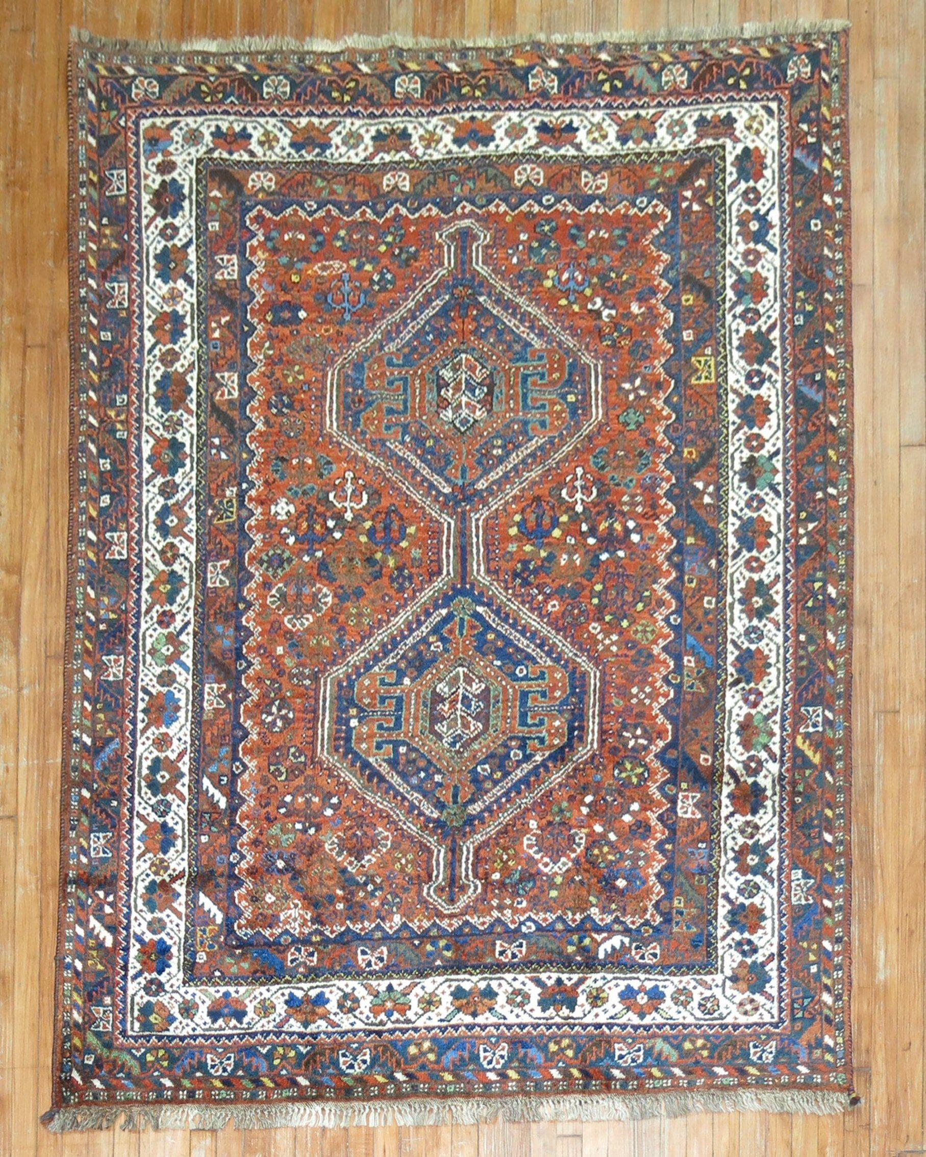 An early 20th century Persian Shiraz small accent square size tribal rug in rustic colors.

circa 1930

Measures: 5.10
