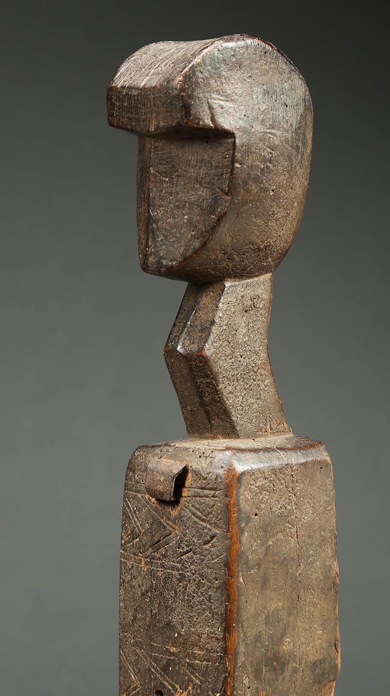 Tribal Bambara figurative wood door lock, Mali, Africa with strong geometric face. Works as strong sculpture with or without the original cross bar. The Bambara of Mali use decorated door locks with a removable key (missing here) to secure the doors