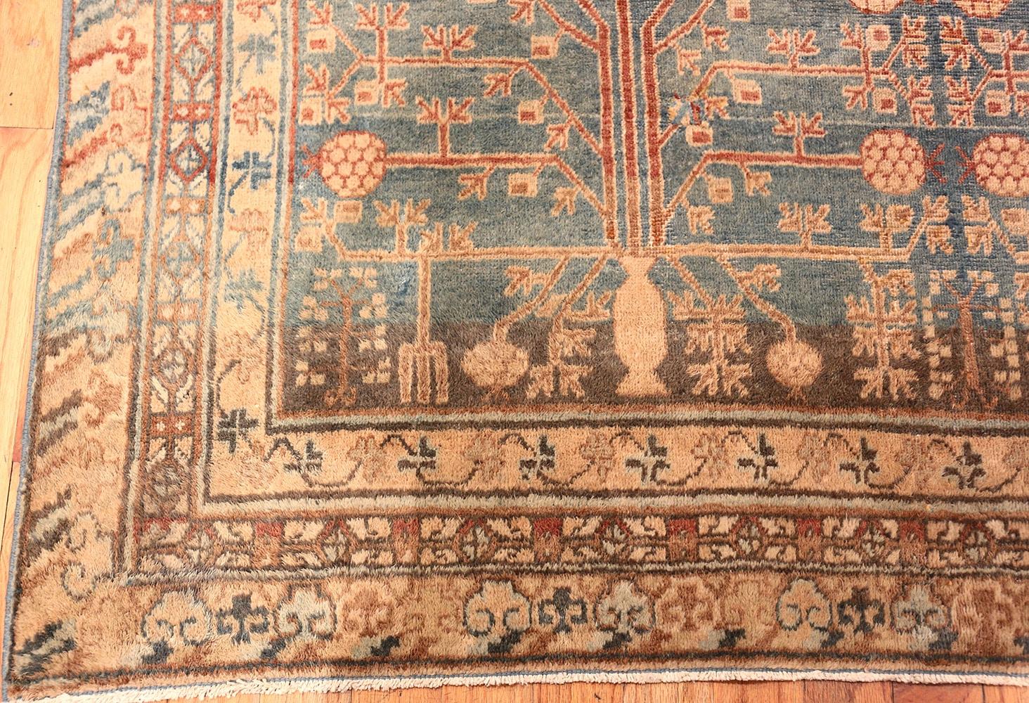 Beautiful long and narrow size blue grey colored background antique pomegranate Khotan rug, country of origin or rug type: East Turkestan rugs, date circa 1900. Size: 6 ft 2 in x 13 ft (1.88 m x 3.96 m)

