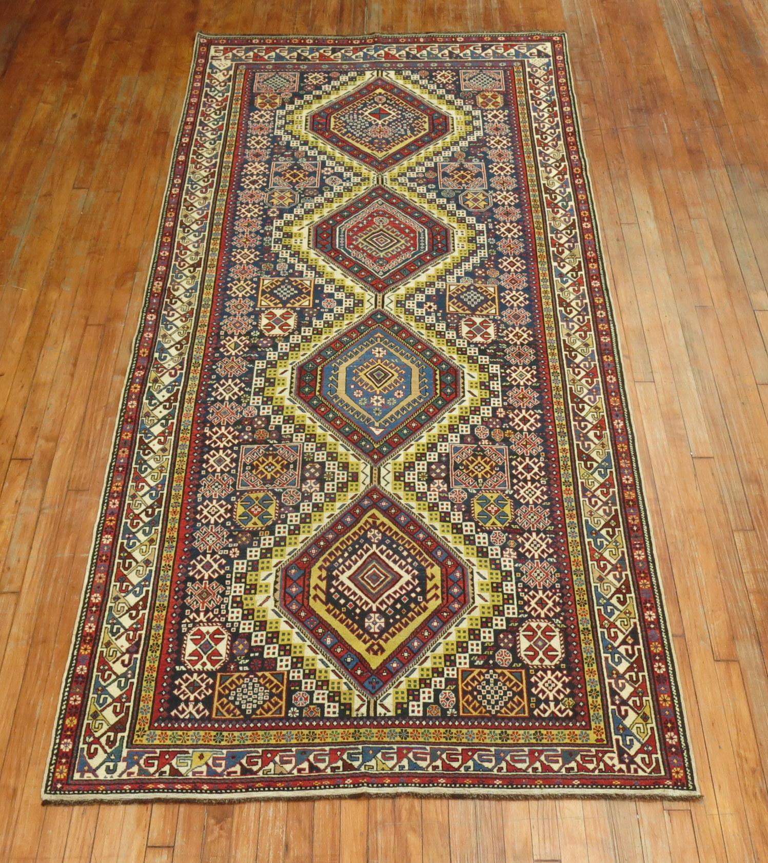 A rare size, authentic one-of-a-kind handmade late 19th century Caucasian wide gallery size runner.

Measures: 4'9