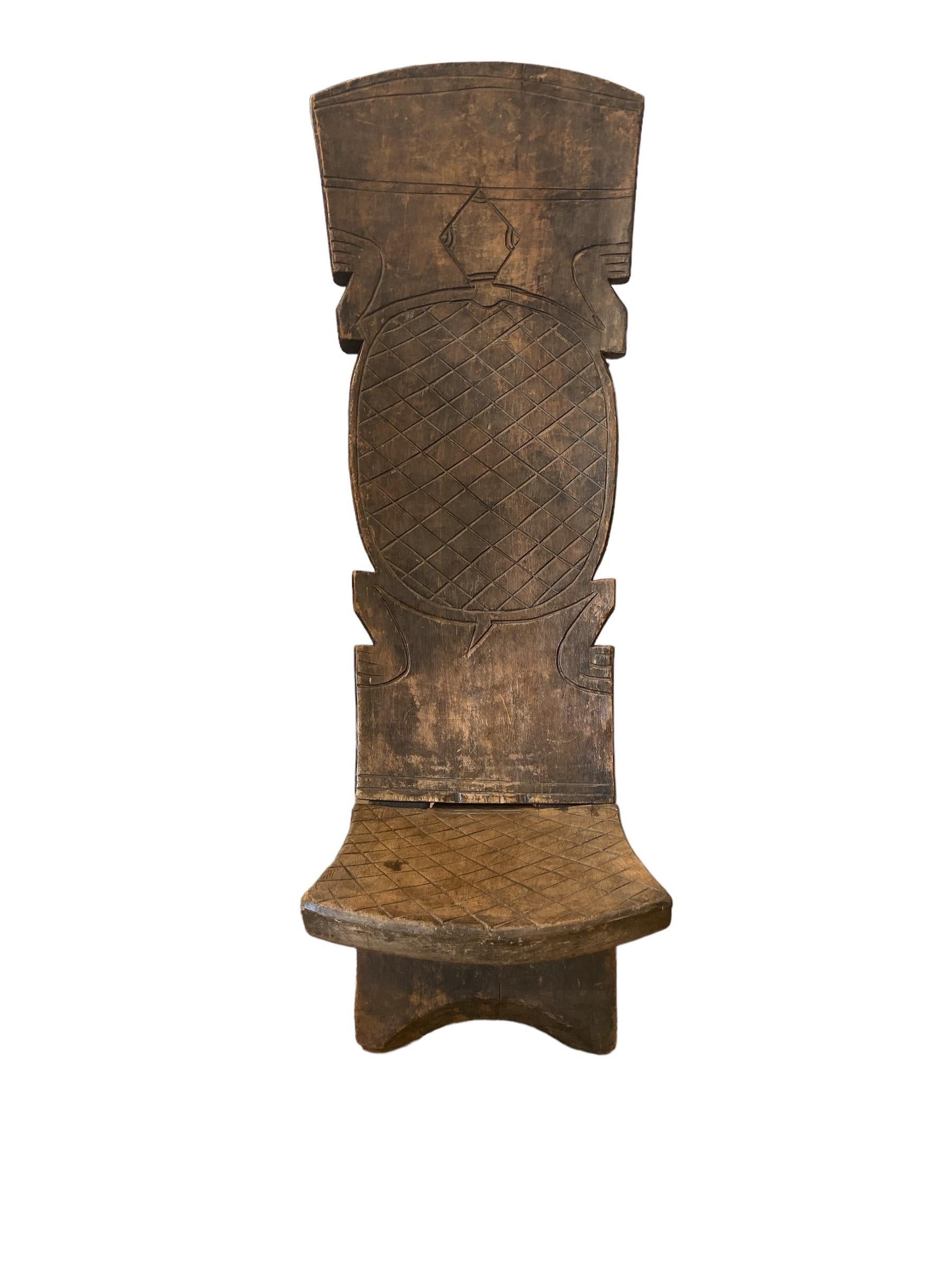A hand-carved Tribal chair with a turtle in the back.
(South?) Africa, ca. 1950. Two-piece, comfortable and strong.
