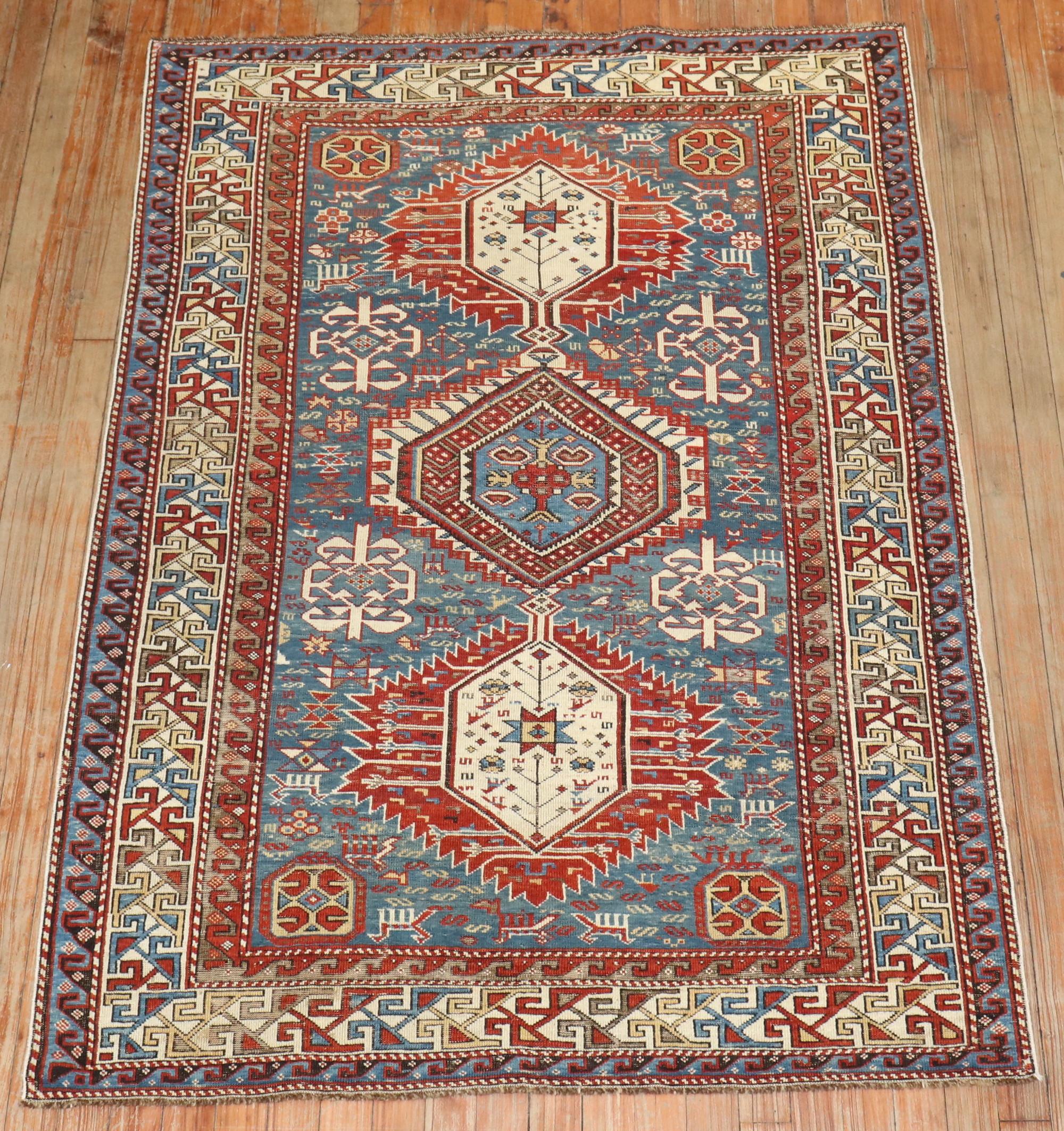 A late 19th century Tribal Antique Caucasian shirvan rug with a large-scale geometric pattern on a lovely sky blue field. 

3'9'' x 5'4''

Antique Shirvan Caucasian rugs of this caliber ceased to be produced around the turn of the 20th century. With