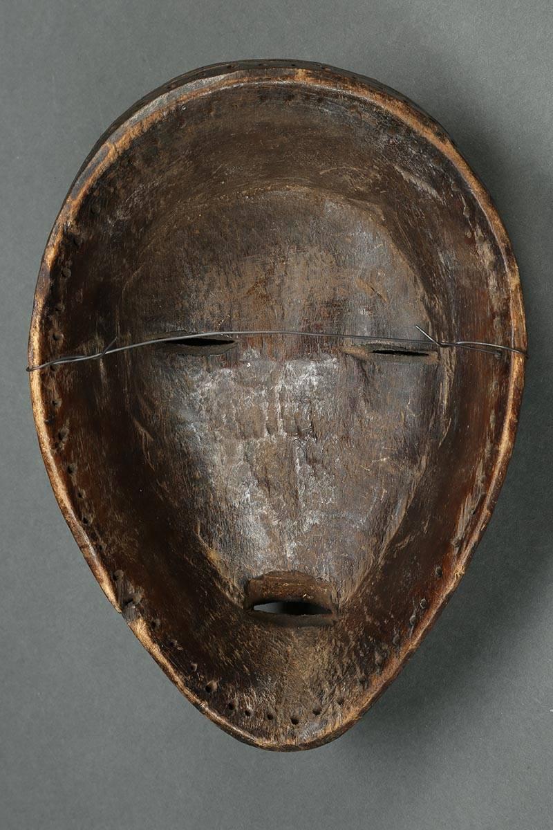Offered by Scott McCue
Tribal Dan Mask, Liberia, early to mid-20th century, Africa

Old Dan mask with signs of wear and use to front and inside, row of fine holes around edge for attaching to dance costume. Raised eyebrows and delicately carved