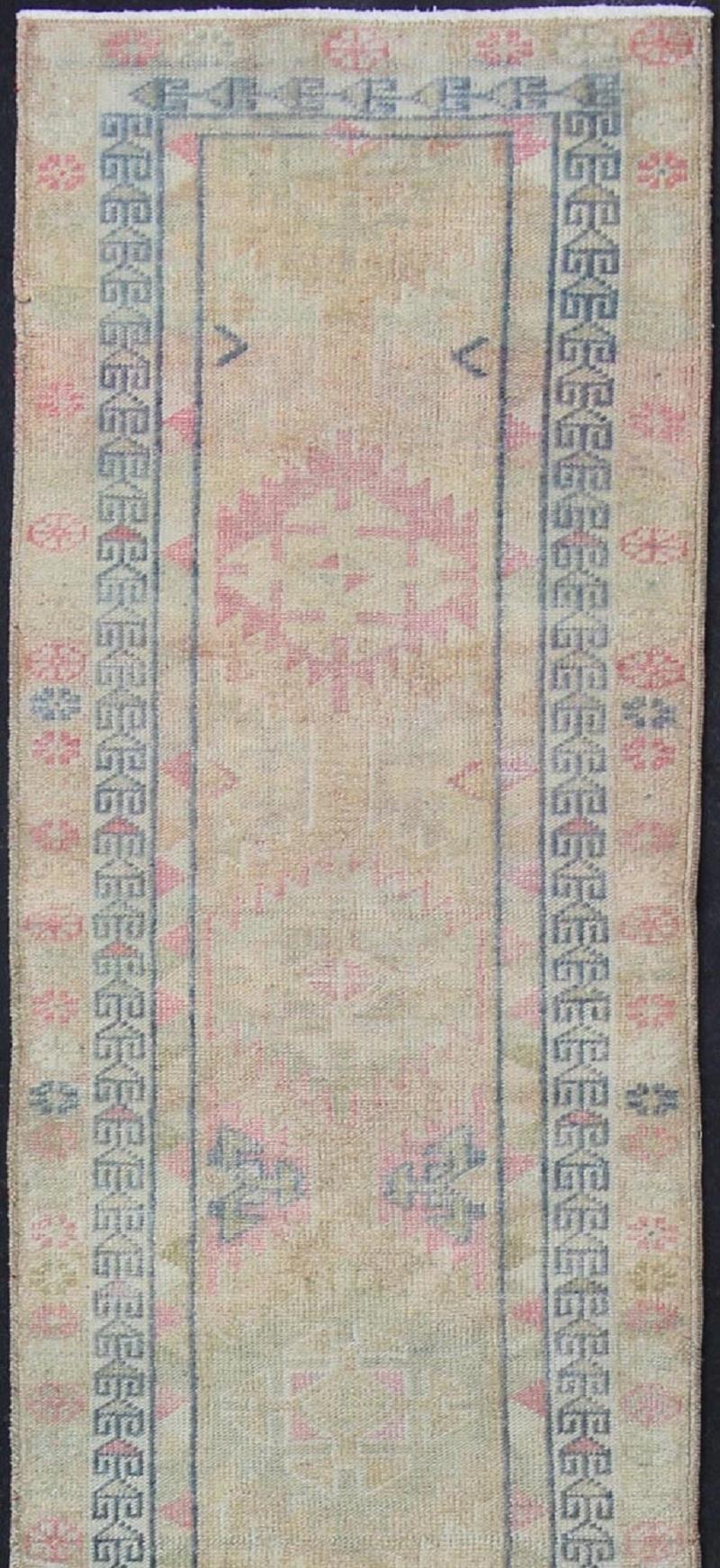 Hand-Knotted Tribal Design Vintage Turkish Runner in Light Pink, Sapphire Blue & Muted Tones For Sale
