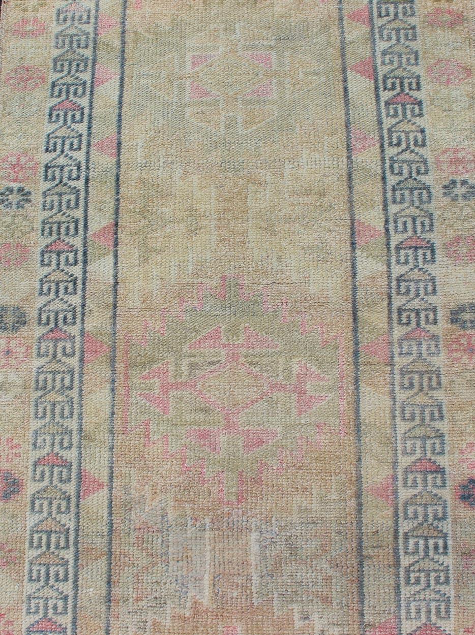 Mid-20th Century Tribal Design Vintage Turkish Runner in Light Pink, Sapphire Blue & Muted Tones For Sale