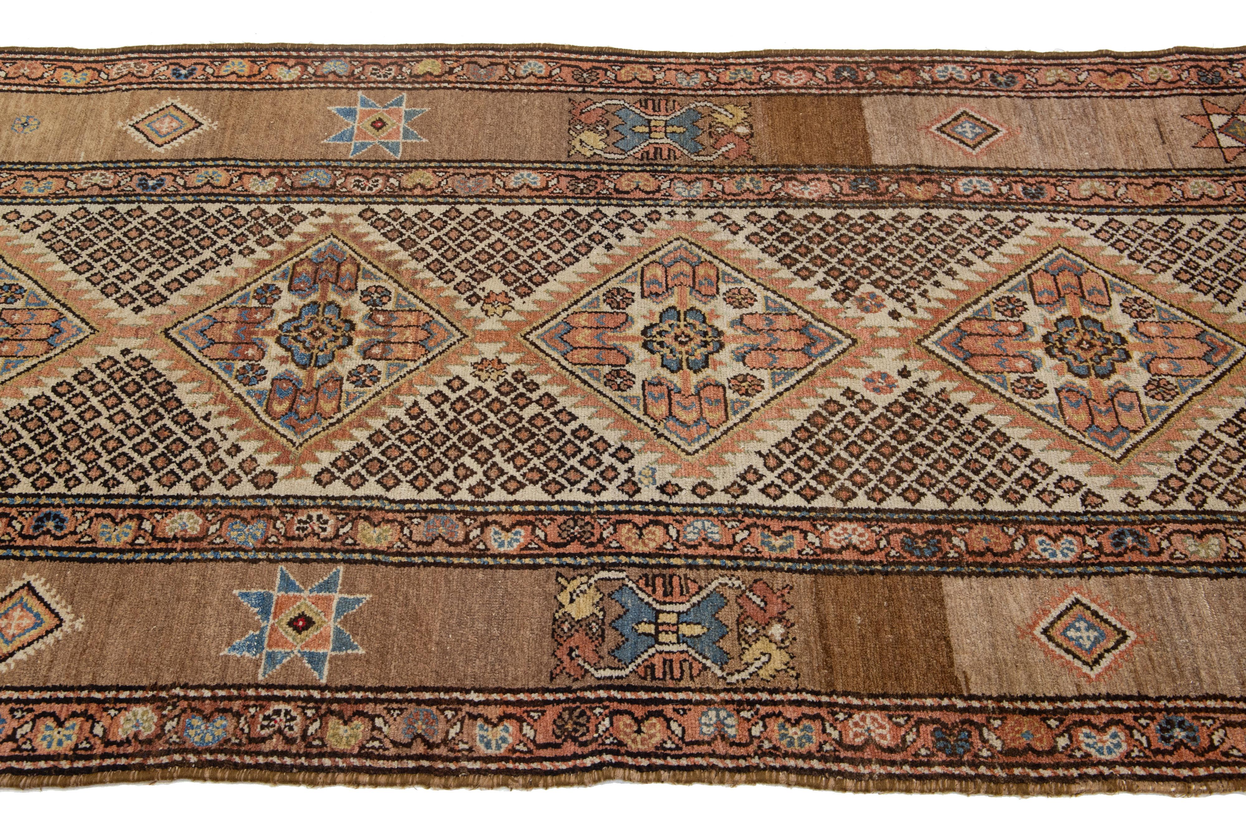 20th Century Tribal Designed Antique Wool Runner Persian Malayer From The 1900s In Beige For Sale