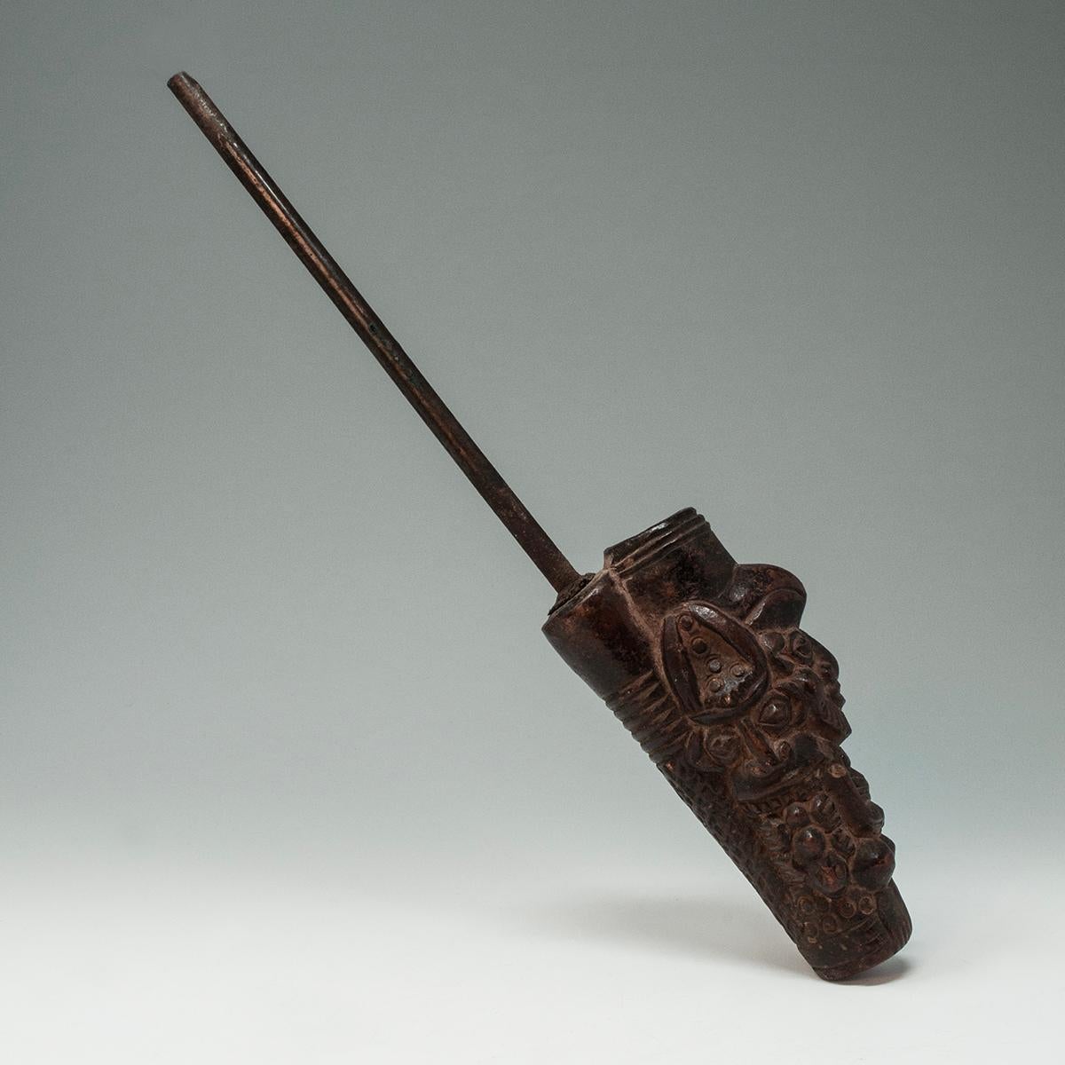 Tribal Early 20th Century Ceremonial Pipe, Bamoun People, Cameroon

A ceremonial tobacco pipe fashioned of hardened clay depicting three bearded men, the center figure with arms on chest; each figure is wearing a headdress. Anthropomorphic pipes of