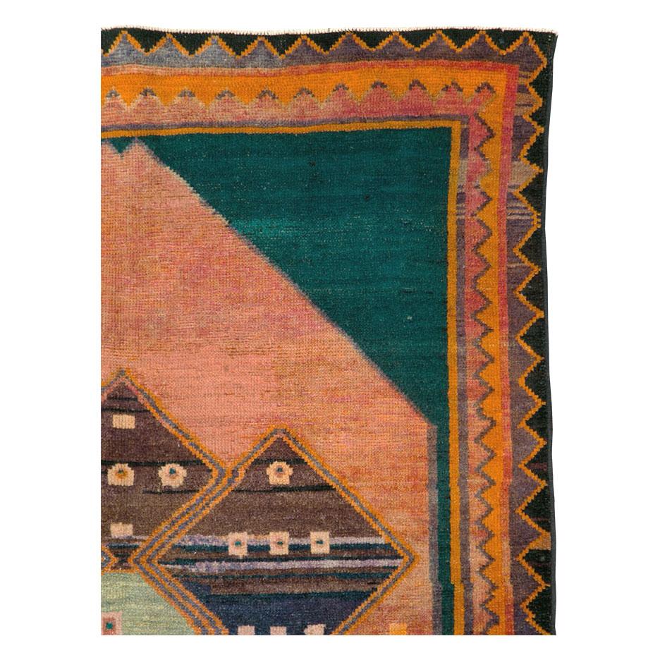 An antique Persian Gabbeh tribal accent rug handmade during the early 20th century.

Measures: 4' 8