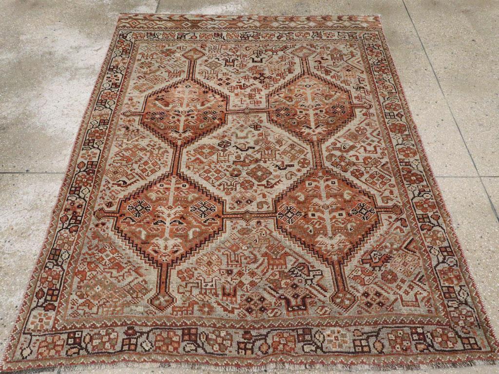 An antique Persian Shiraz tribal accent rug handmade during the early 20th century.

Measures: 4' 9