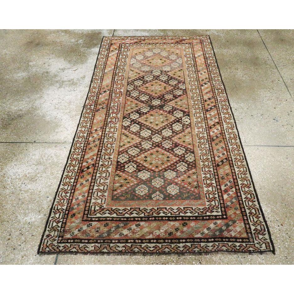 An antique Persian Shiraz small tribal accent rug handmade during the early 20th century.

Measures: 3' 6