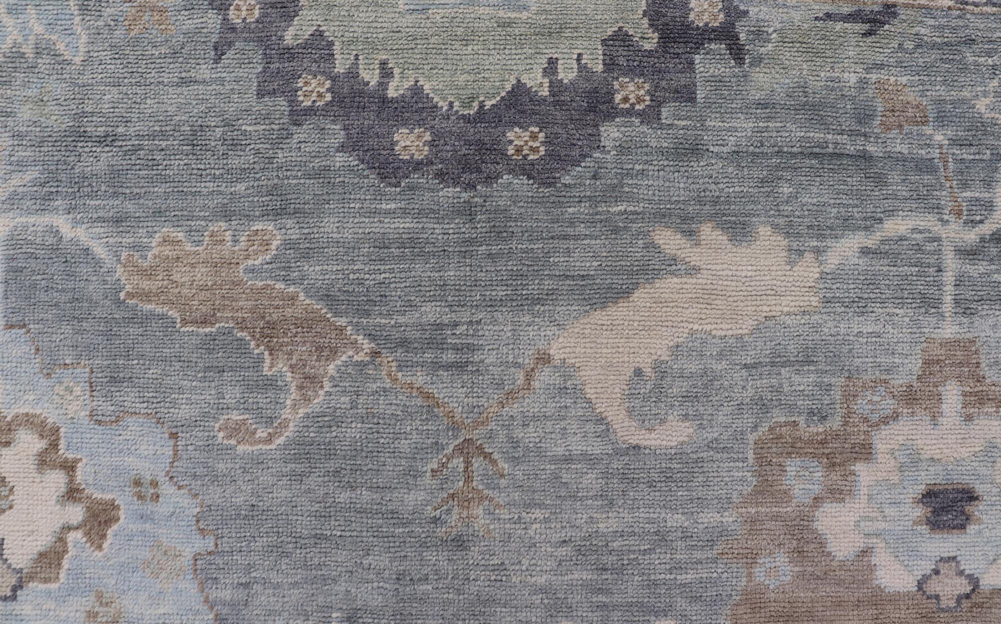 Contemporary Tribal Floral Design Hand Knotted Turkish Oushak Rug with Blues and Brown For Sale