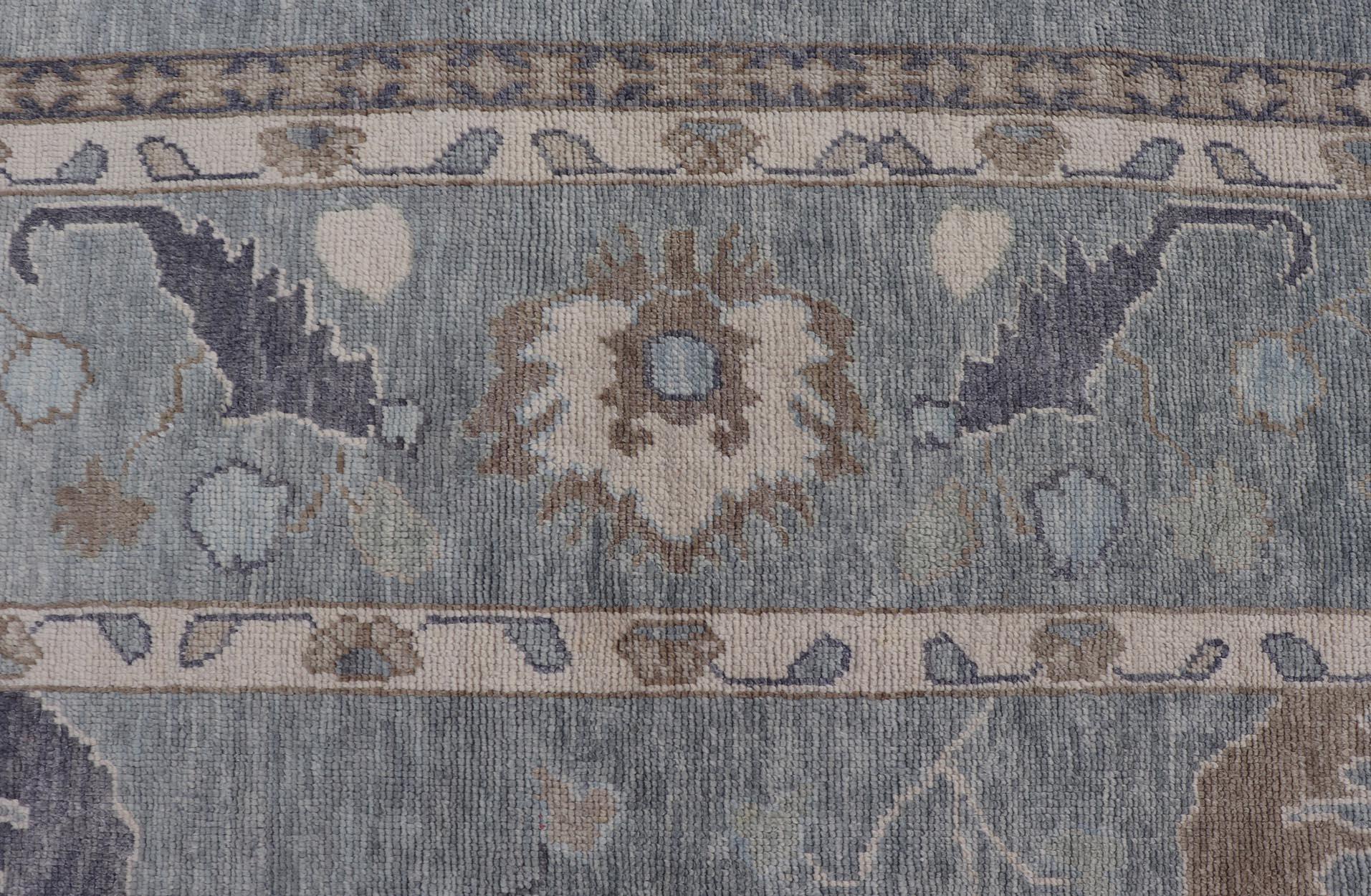Tribal Floral Design Hand Knotted Turkish Oushak Rug with Blues and Brown For Sale 1