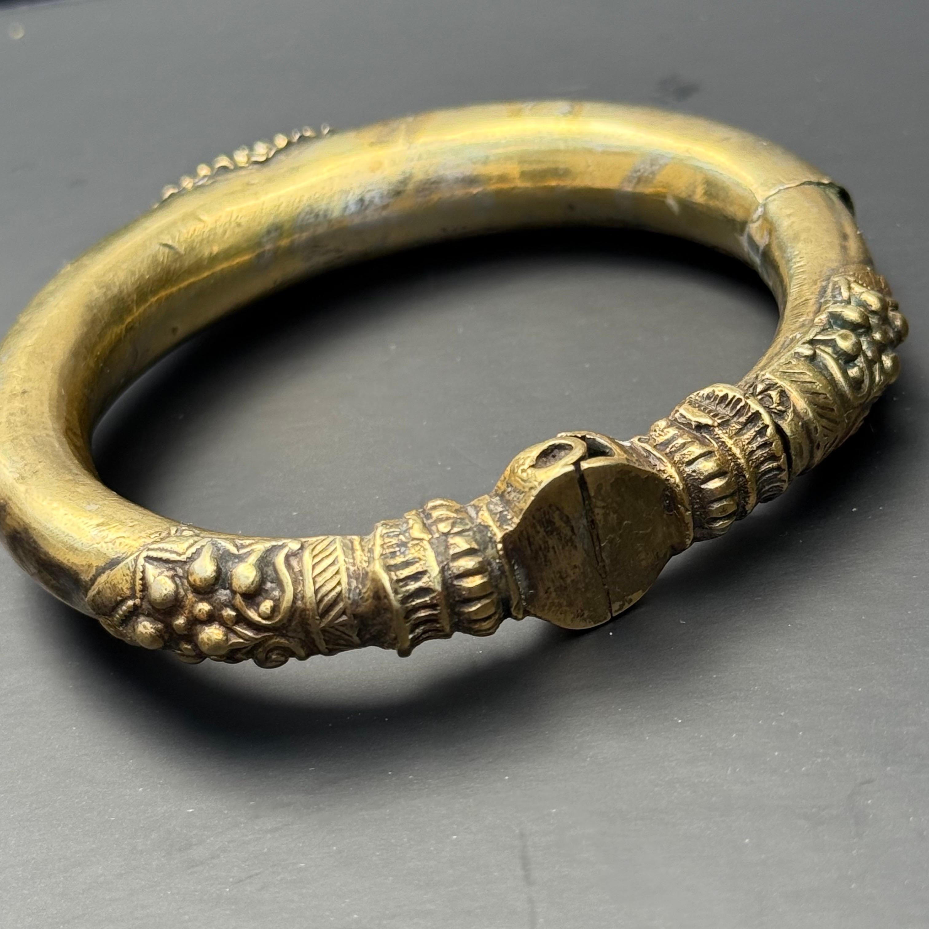 An exceptional tribal bangle or anklet from Rajasthan, India, dating to the mid-20th century. Known regionally as a Kadla or Kadiya, this piece was traditionally worn by Rajasthani tribal women as both an arm or ankle adornment, symbolizing