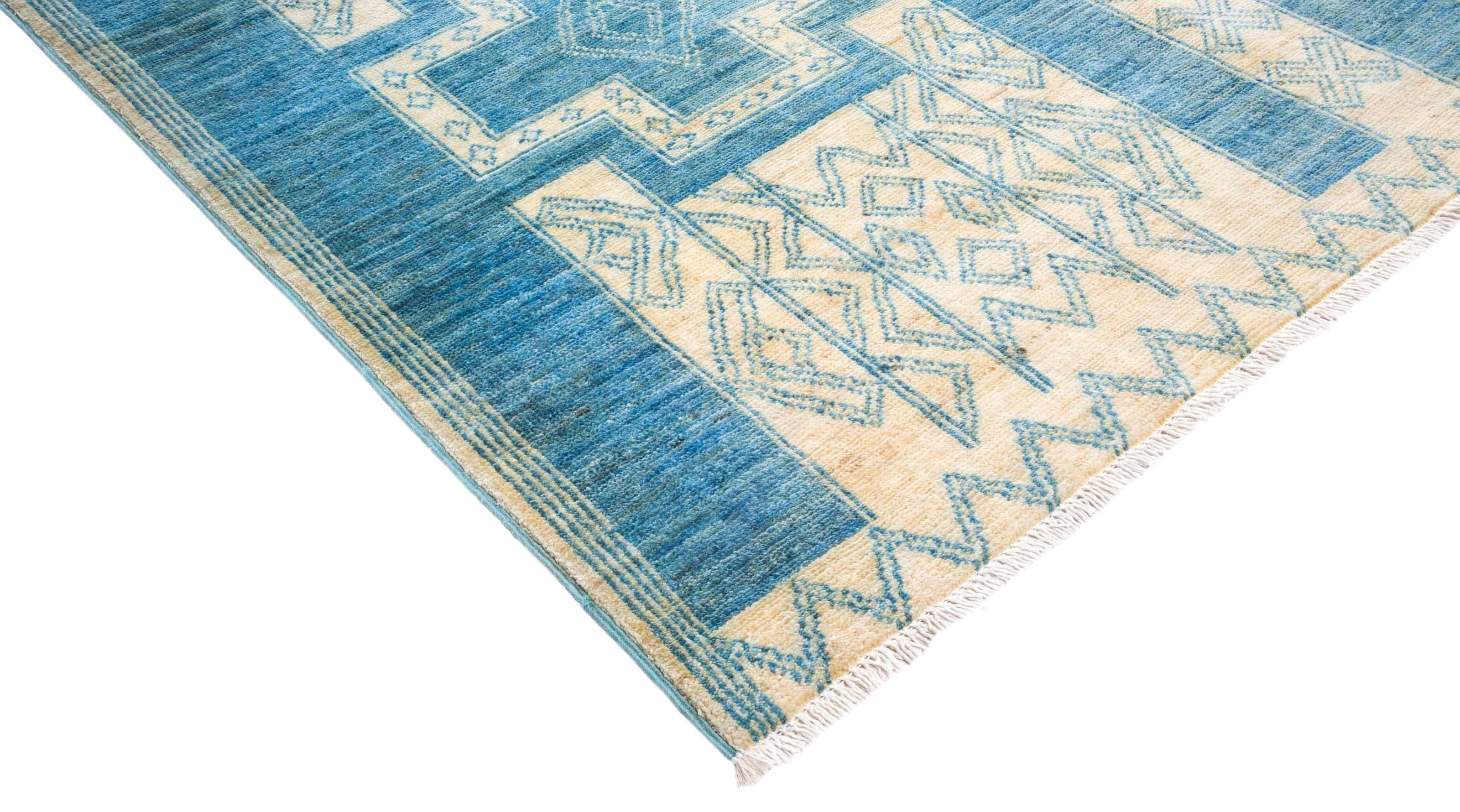 Color: Ivory - Made In: Pakistan. 100% Wool. The rich textile tradition of western Africa inspired the Tribal collection of hand-knotted rugs. Incorporating a medley of geometric motifs, in palettes ranging from earthy to vivacious, these rugs bring