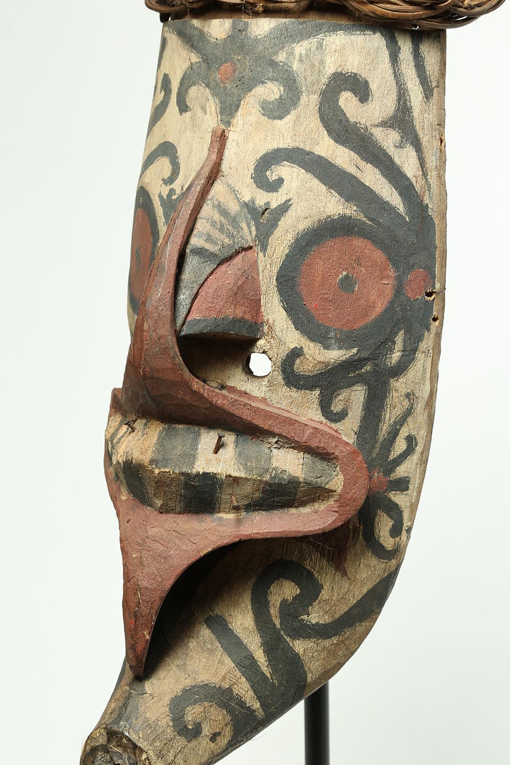 Tribal wood and pigment Borneo Dayak Hudoq mask on stand, Indonesia, early 20th century
Painted wood Dayak Hudoq tribally used mask with remains of black, red and white pigments. Part of headdress still attached, and fibers in chin, early 20th