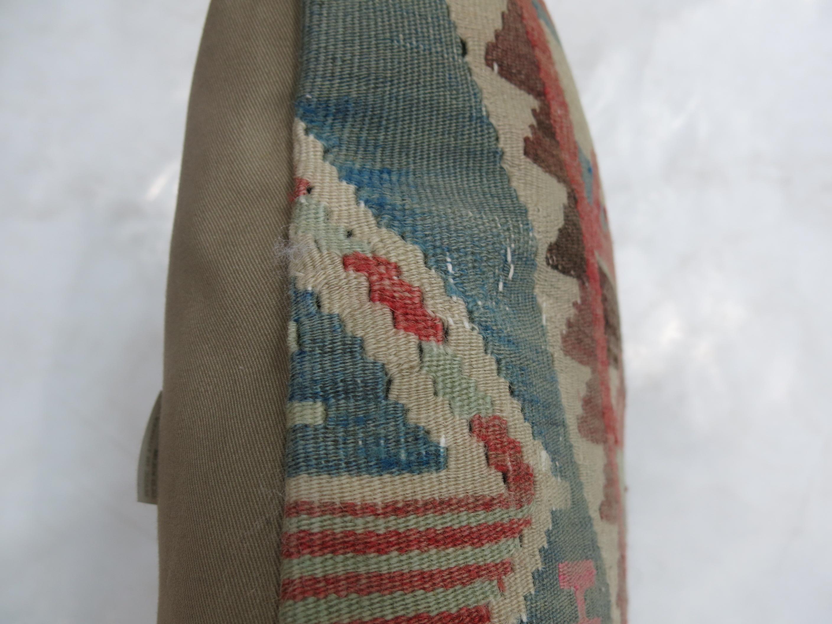 Pillow made from a vintage Turkish Kilim flat-weave.