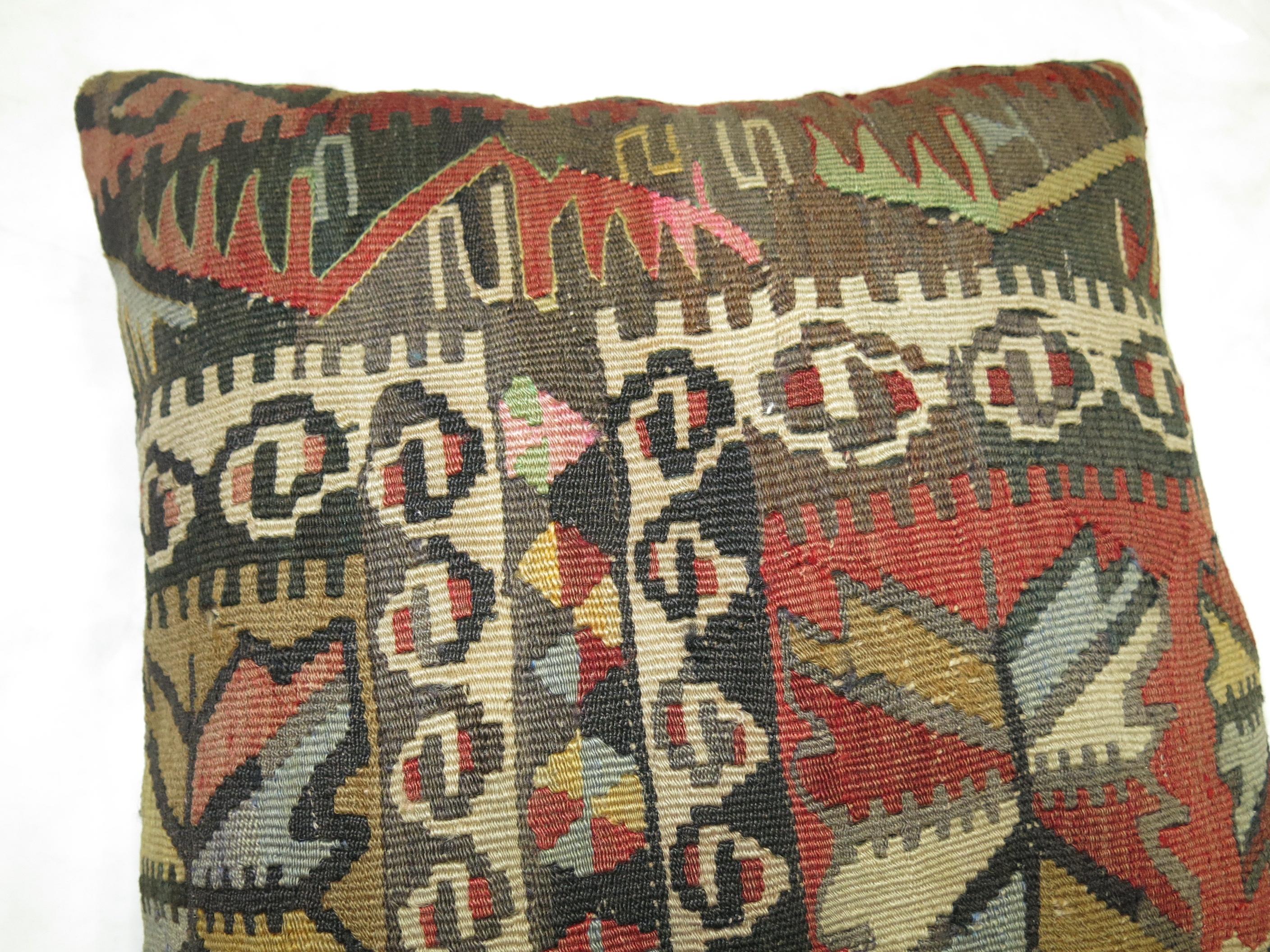 Pillow made from a vintage Turkish Kilim flat-weave.