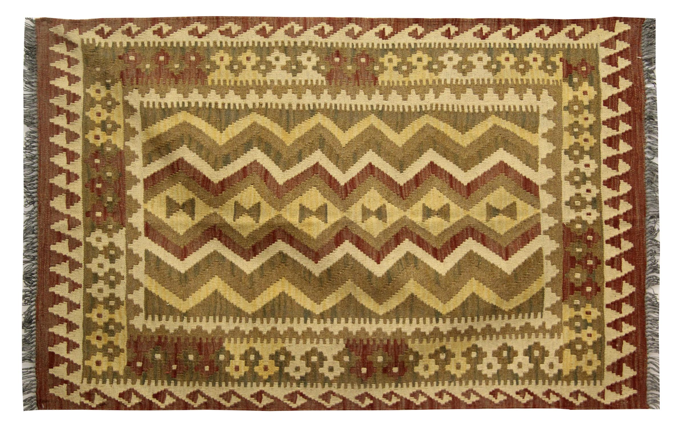 This tribal pattern rug is beautifully designed and delicately woven with the finest hand-spun wool. Featuring asymmetrical tribal pattern handwoven with a rich rustic colour palette of beige, cream and brown. With a simple repeat hook design