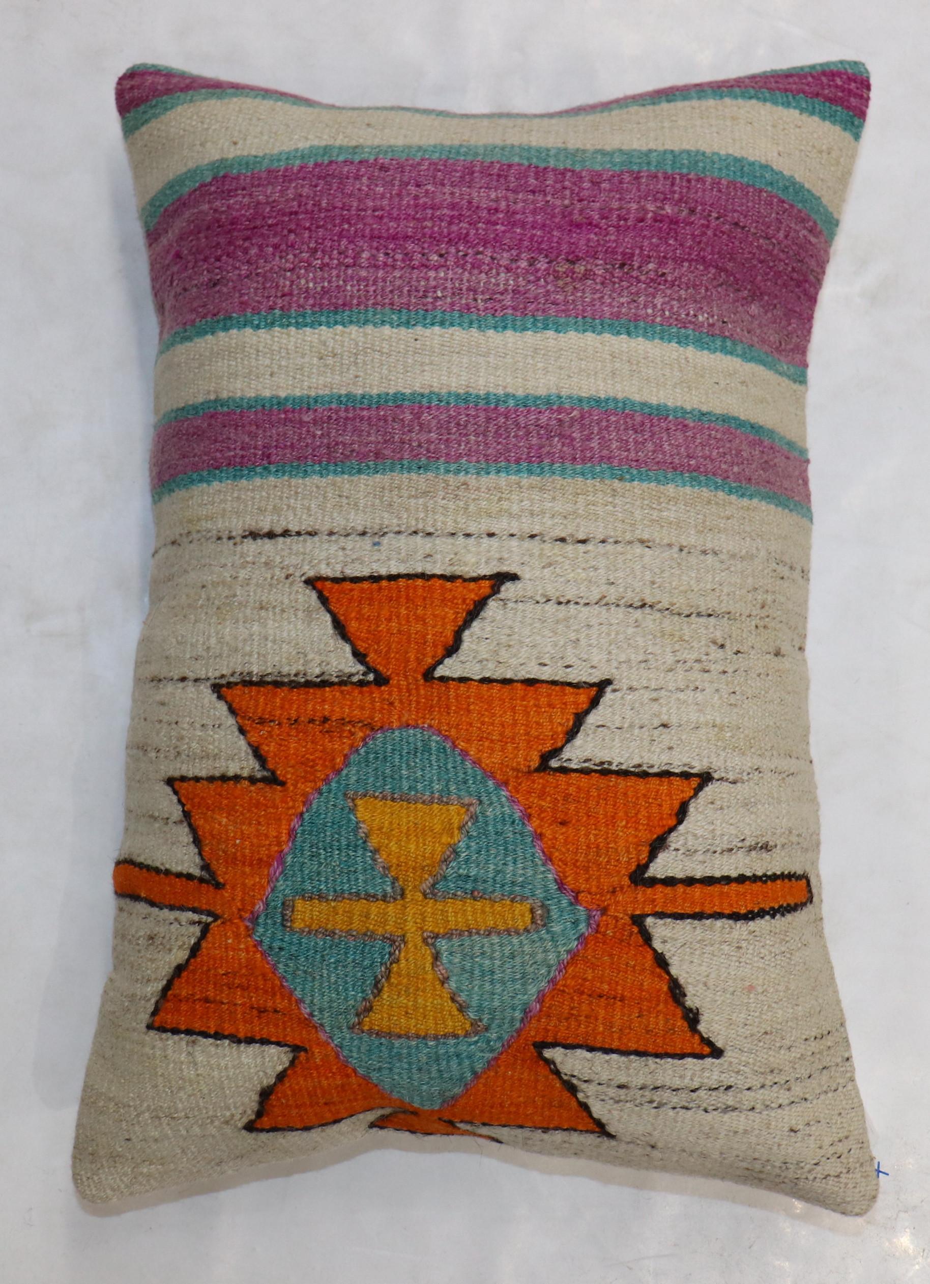 Pillow made from modern Turkish Kilim in white with a medallion in orange. Zipper closure and poly-fill insert provided.

Measures: 16