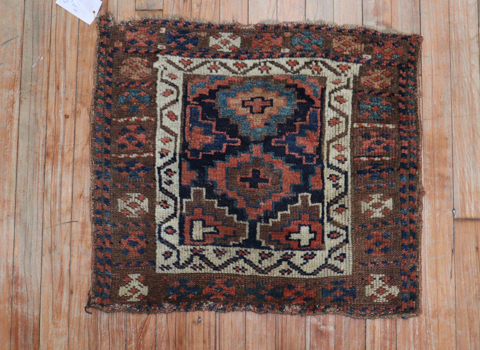 An early 20th century colorful Kurd Bagface rug 

Measures: 1'11'' x 2'2''.