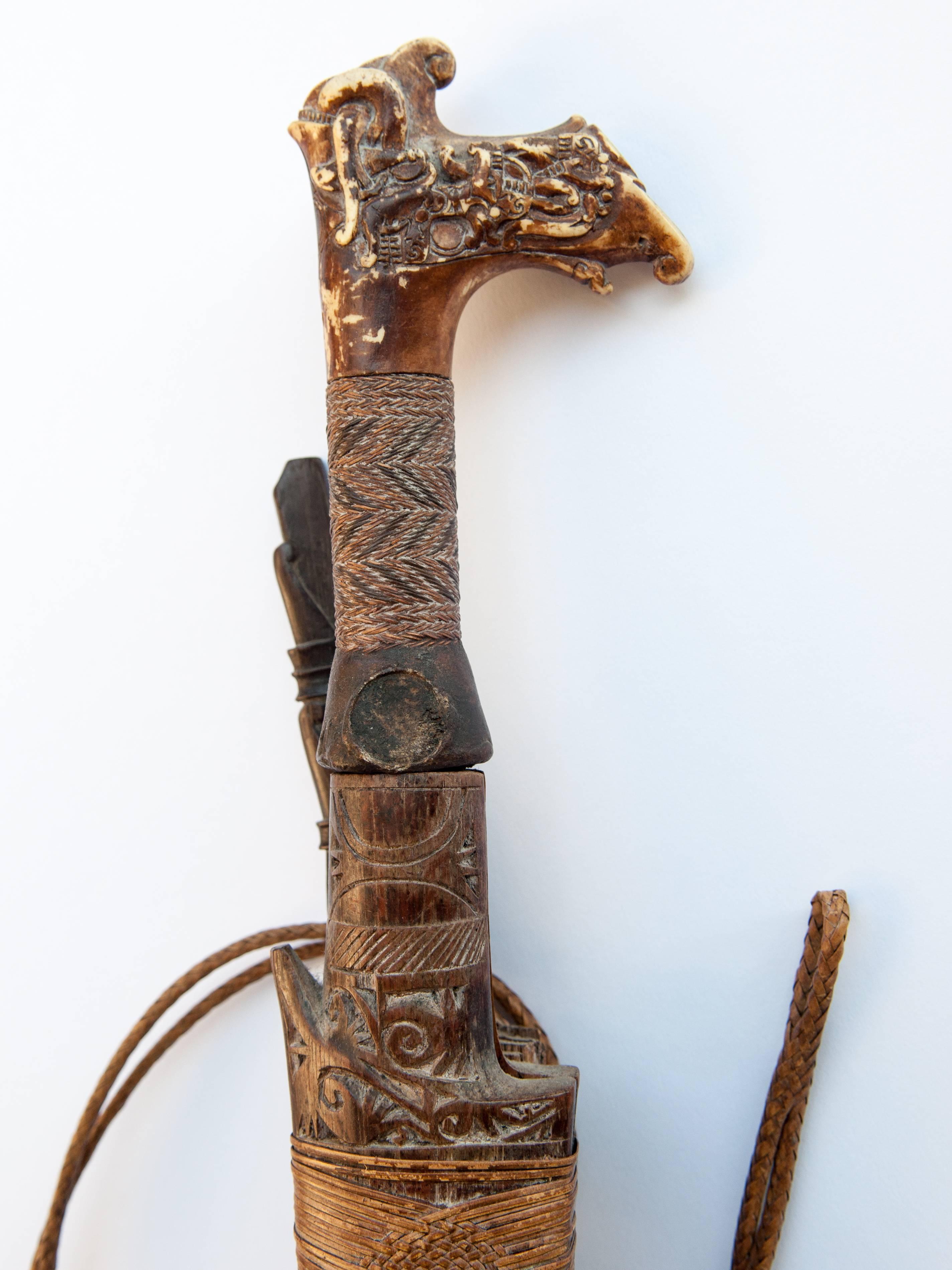 Tribal Mandau sword with Scabbard from the Dayak of Borneo, early 20th century.
Offered by Bruce Hughes.
Called Mandau or Parang Ilang, these swords were traditionally the most prized position of Dayak men, used in war or headhunting, and infused