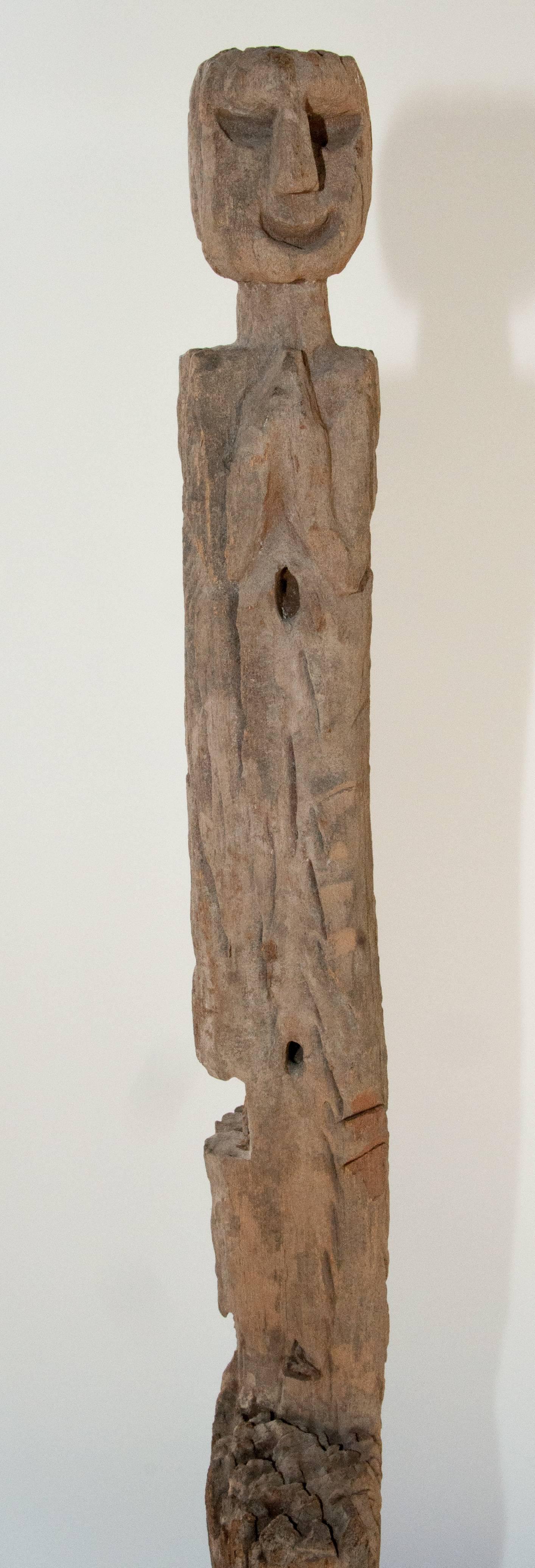 Tribal marking post. Spring marker. Tharu of Nepal, mid-20th century. Metal base
Offered by Bruce Hughes.
This wonderfully eroded ritual post was set in the ground and would most probably have marked a spring or water source. Long years of exposure