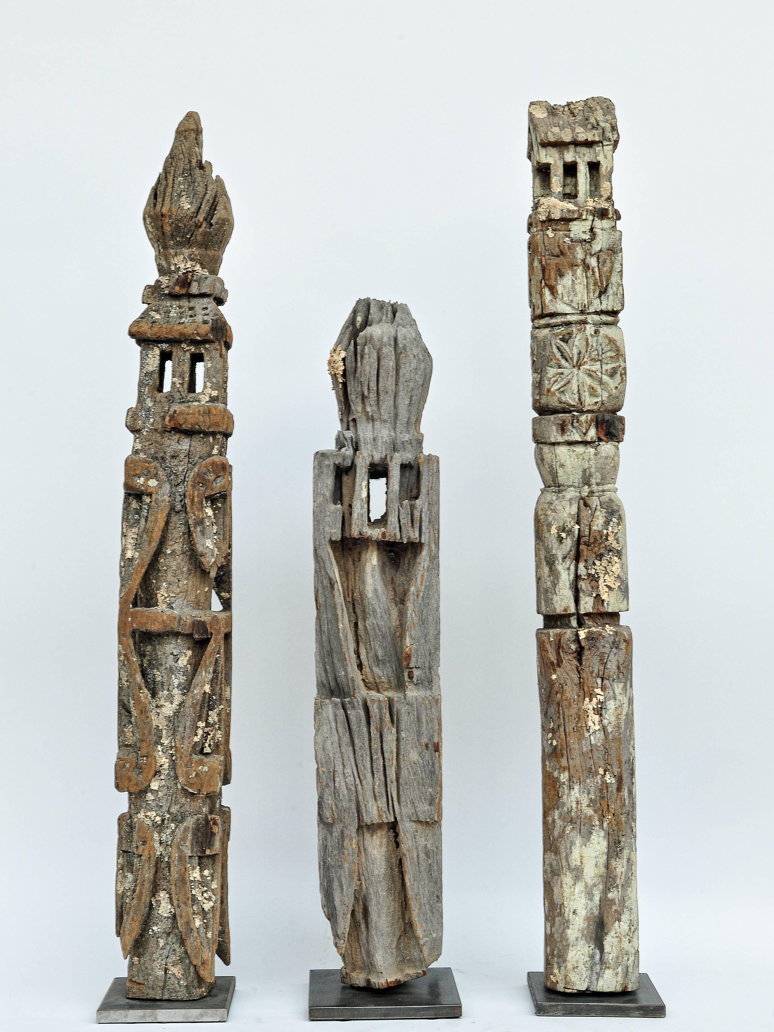 Tribal marking posts from West Nepal. Set of three, early to mid-20th century. Mounted on a metal plate.
These marking posts, called Maulas, come from West Nepal, where they would have been placed near a spring, trail, or bridge, or perhaps in a