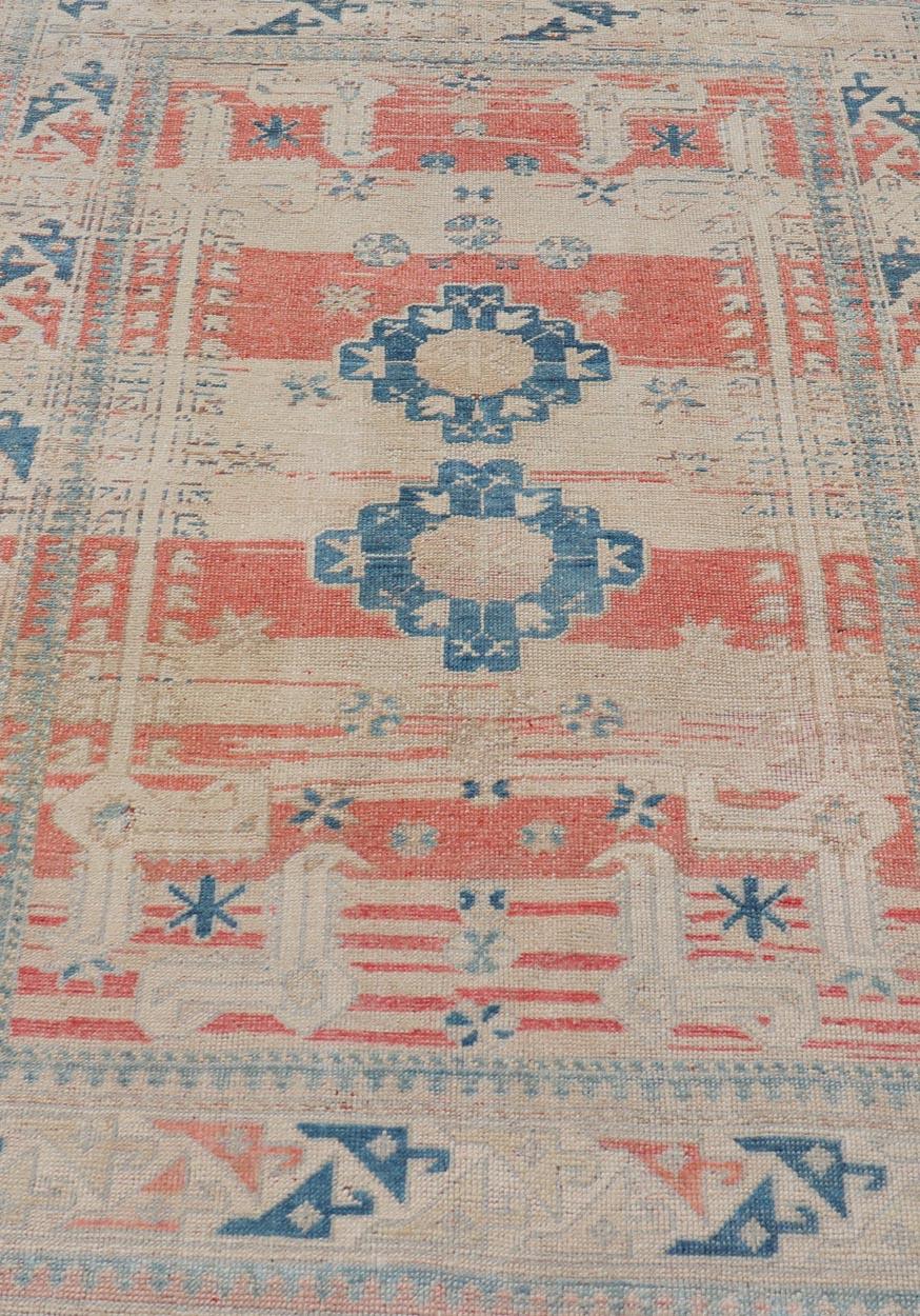 Hand-Knotted Tribal Medallion Design Vintage Turkish Oushak in Cream, Blue, and Terracotta For Sale