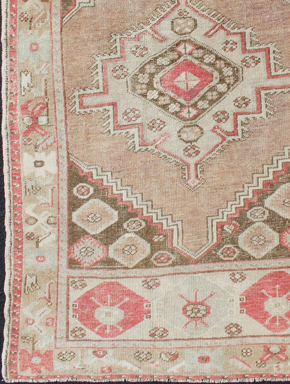 Hand-Knotted Tribal Medallion Design Vintage Turkish Oushak Rug in Earth Tones & Coral Pink For Sale