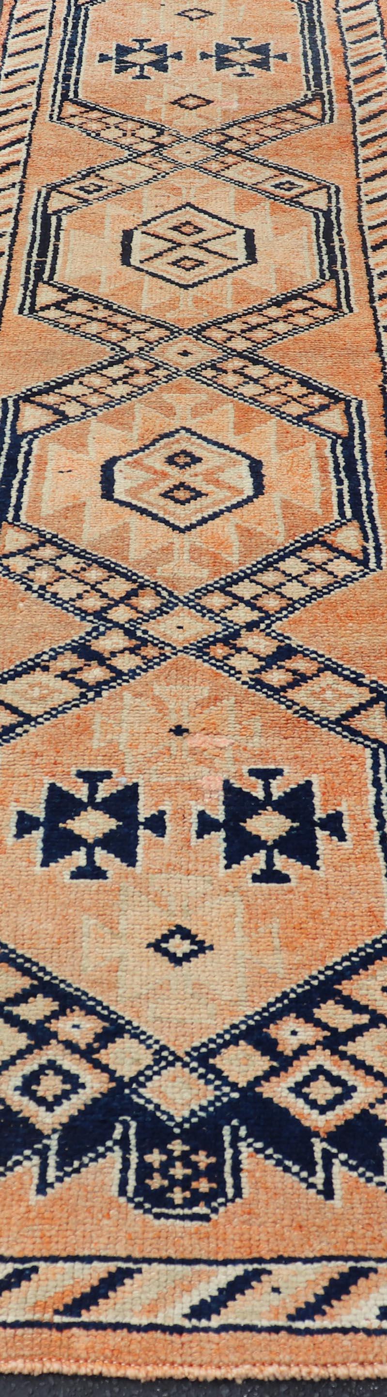 Oushak runner with tribal motifs in blue and orange, Keivan Woven Arts / rug TU-MTU-141, country of origin / type: Turkey / Oushak, circa 1960

Measures: 2'11 x 12.