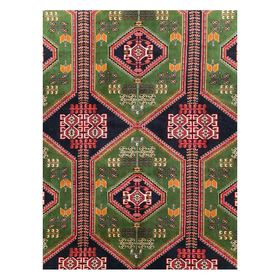 A vintage Central Asian tribal Turkoman room size carpet handmade during the mid-20th century.

Measures: 9' 10