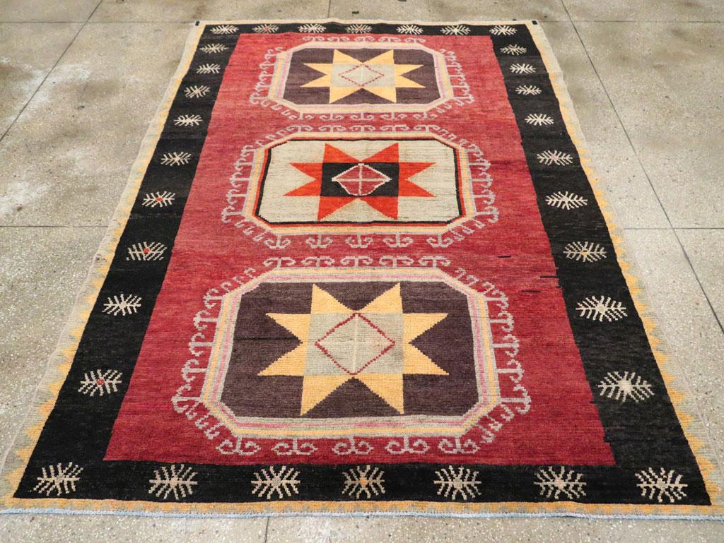 Tribal Mid-20th Century Handmade Turkish Anatolian Accent Carpet in Red & Black In Excellent Condition In New York, NY