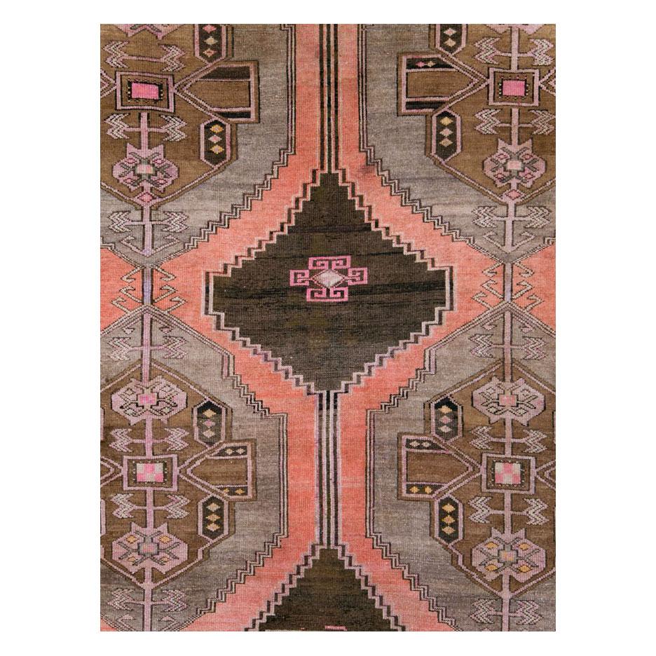 A vintage Turkish Anatolian room size carpet with a tribal design handmade during the mid-20th century.

Measures: 9' 11
