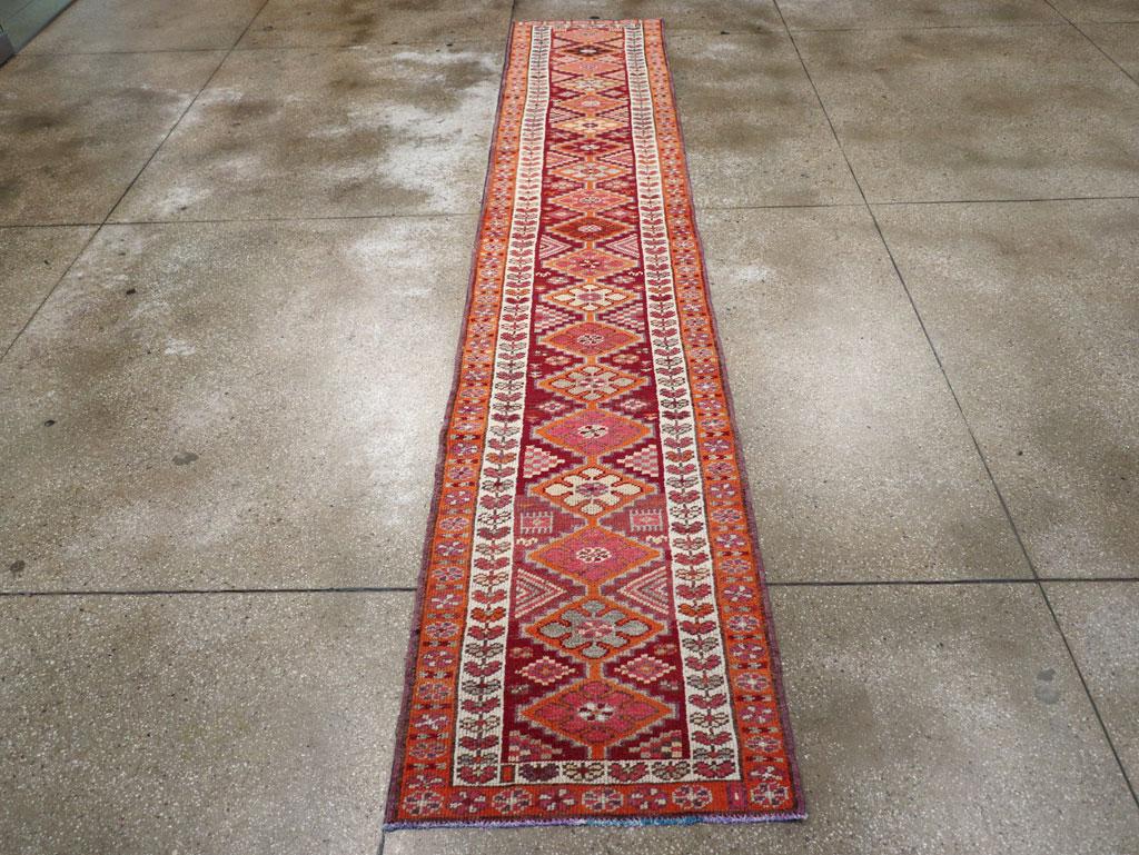 A vintage Turkish Anatolian tribal runner handmade during the mid-20th century.

Measures: 2' 8