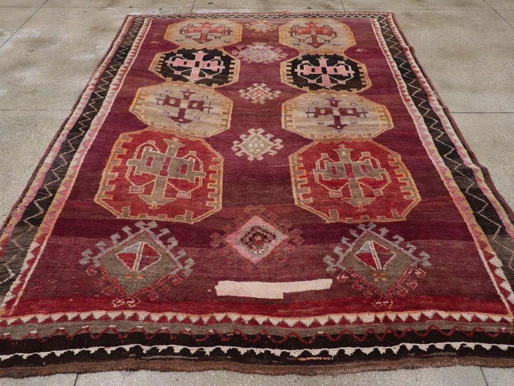 A vintage Turkish Anatolian small room size tribal carpet handmade during the mid-20th century.

Measures: 8' 1