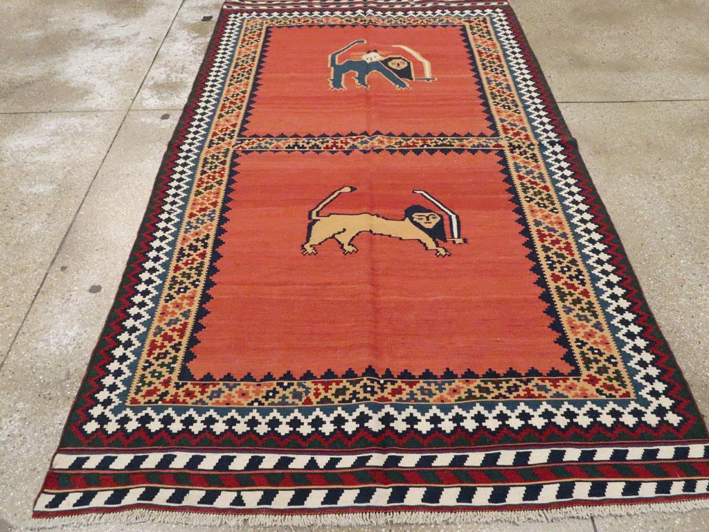 A vintage Persian flat-weave Kilim accent rug handmade by the Qashqai tribes of Persia during the mid-20th century with a pictorial design featuring 2 'Lion With Sword' motifs.

Measures: 5' 1