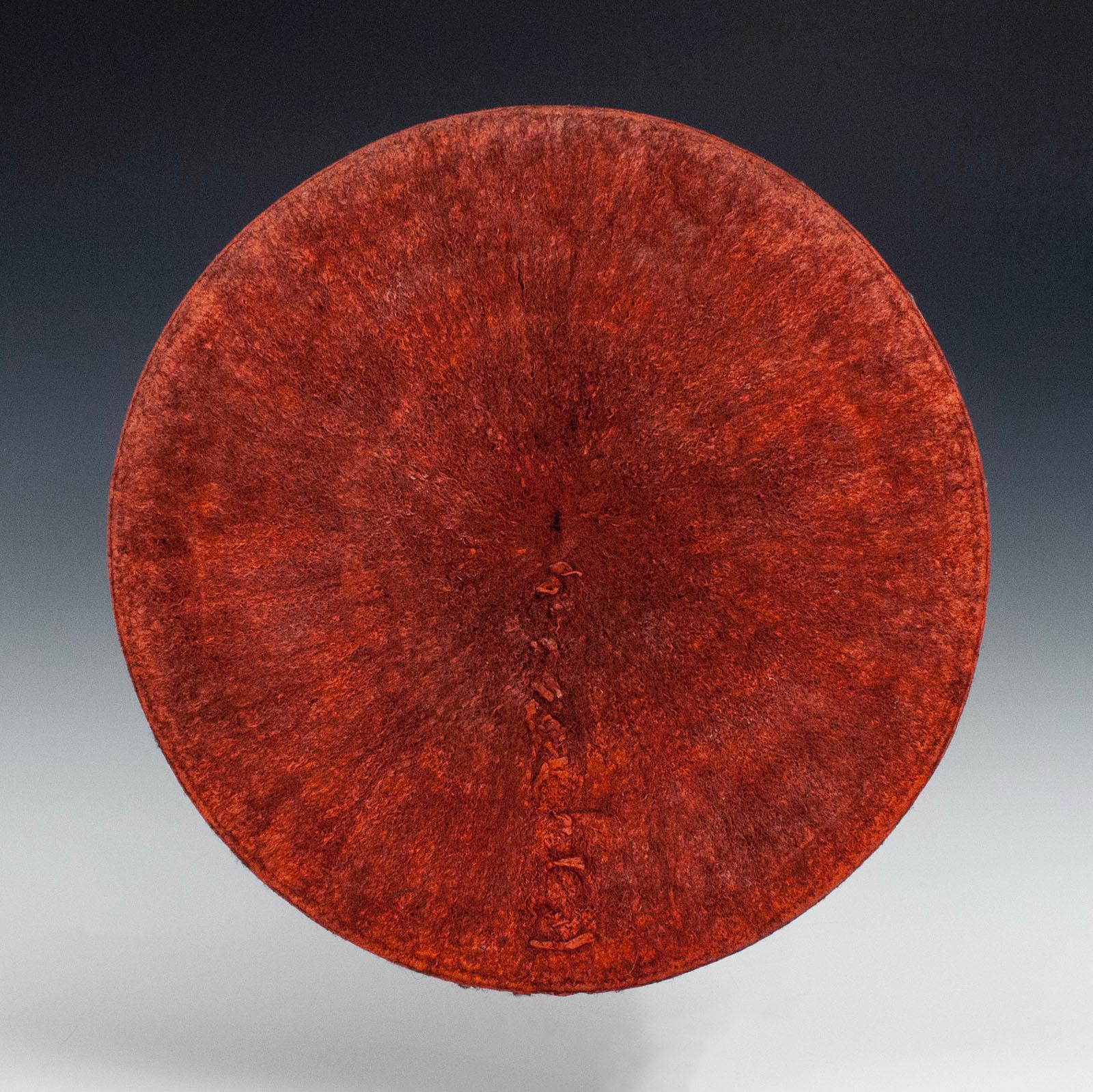 Mid-20th century Tribal Zulu women's ochre human hair hat, Isicholo, from South Africa.

Inspired by traditional married women’s hairstyles, hats like this began being worn in the 20th century at special events and important ceremonies. It is made