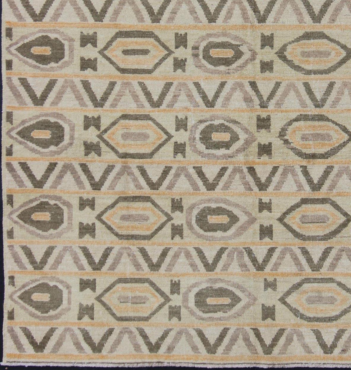 Modern rug Afghan Tribal all-over design, rug 1912-261 country of origin / type: Afghan / Tribal

This tribal Afghan rug with a modern design rendered in an all over Modern pattern, features a cream background, dark olive green and faded orange