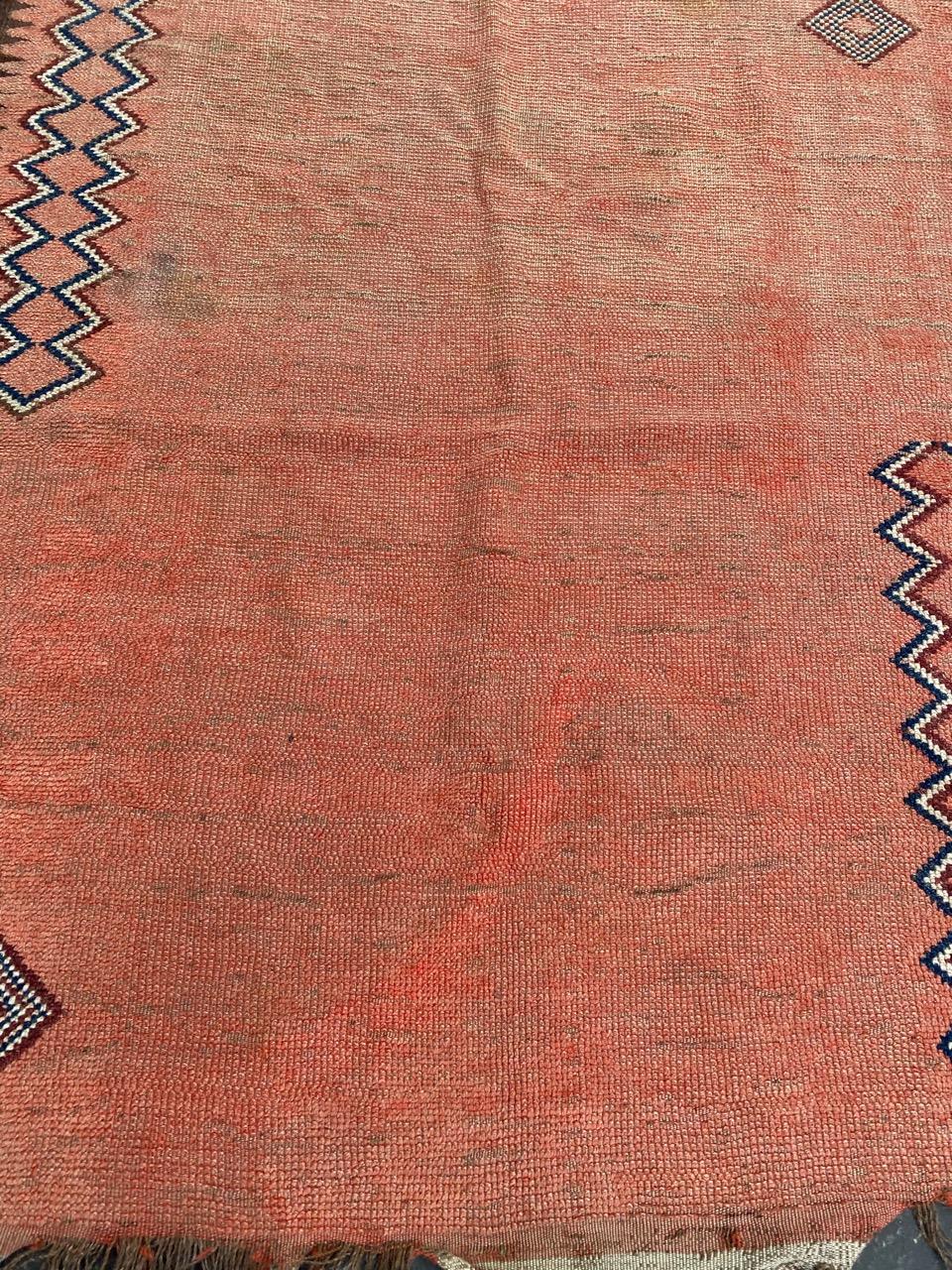 Nice Moroccan rug with a tribal design and an orange field color, entirely hand knotted with wool velvet on wool foundation.