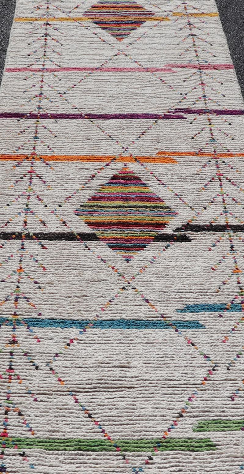 Tribal Moroccan Runner in Wool with Geometric Diamond Design On A Ivory Field. Keivan Woven Arts; rug MSE-12787, country of origin / type: Afghanistan / Modern Casual, circa Early-21th Century.
Measures: 3'0 x 12'11 
This modern casual tribal runner