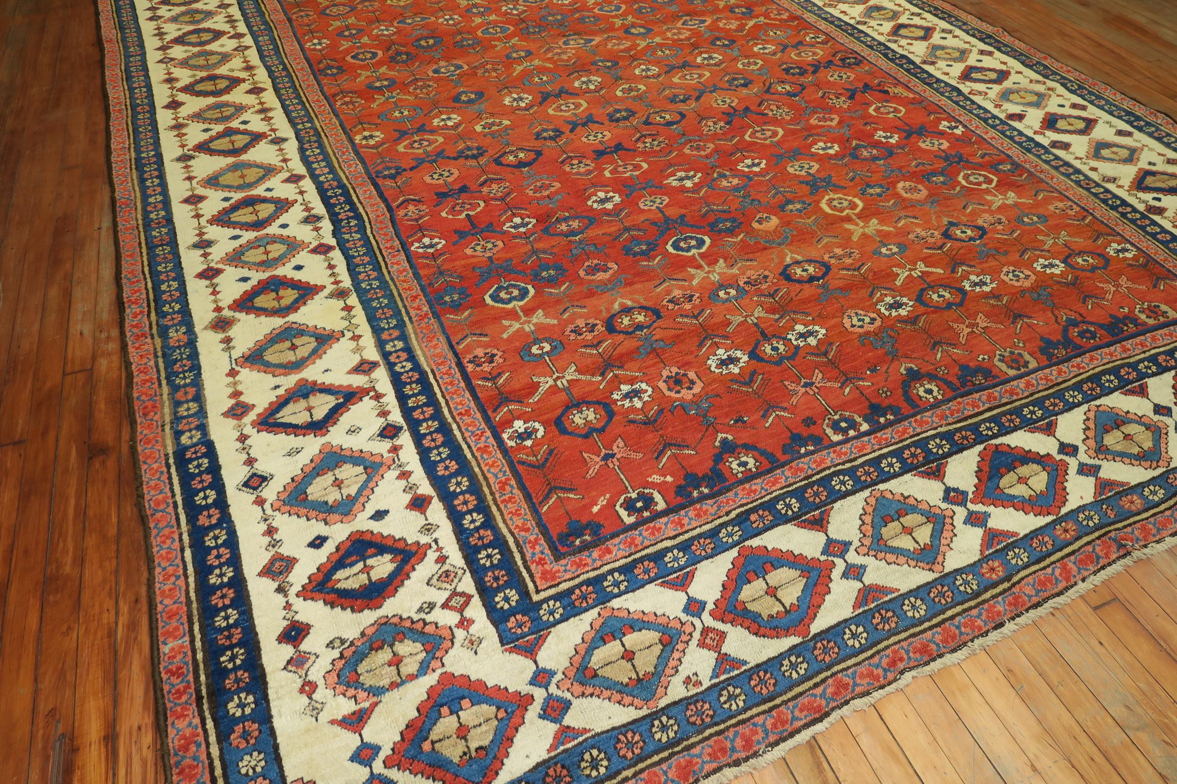 Highly collectible-quality oversize orange all-over field early 20th century Persian Bakshaish rug. The harmonious colors, skillful geometry, and weaver's craftsmanship make this rug an absolute work of art.

Measures: 10'5